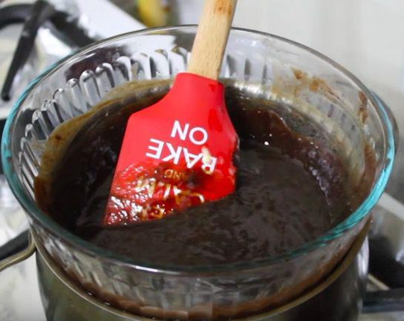 step 1 Over a double boiler, melt Butter (1/2 cup) and Semi-Sweet Chocolate Chips (1 1/3 cups). Add Granulated Sugar (3/4 cup) and Brown Sugar (4 Tbsp). Remove from heat and set aside to cool completely.