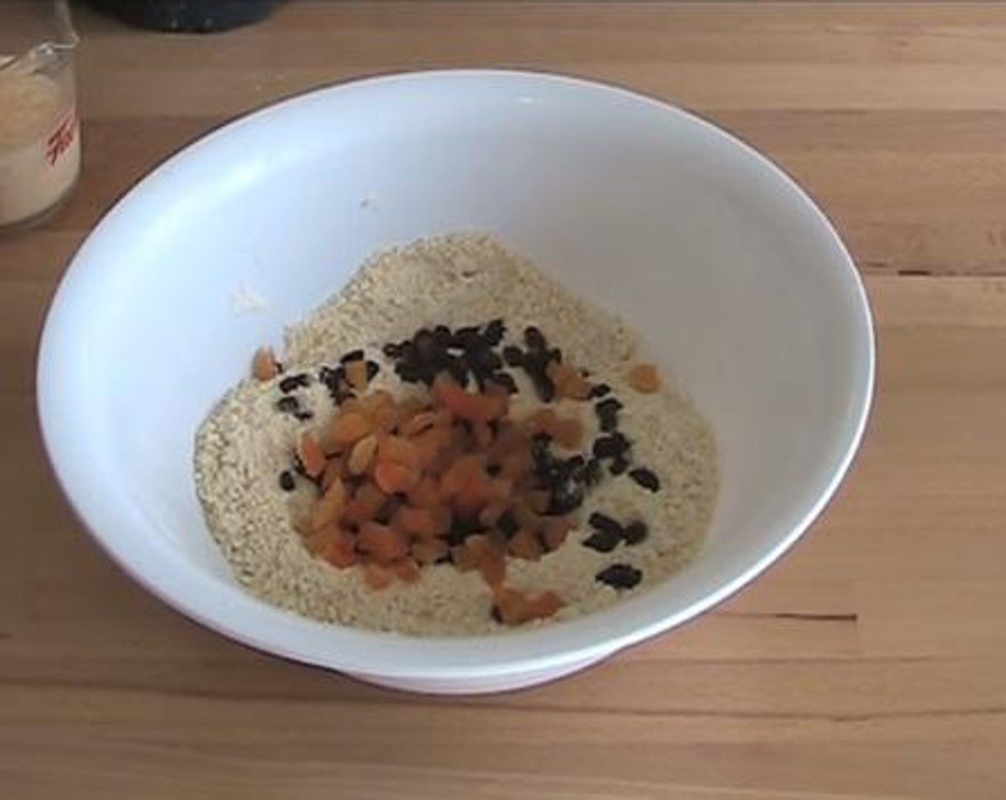 step 2 Into a mixing bowl, add and mix the Self-Rising Flour (2 cups), Ground Cinnamon (1/2 tsp), Caster Sugar (1/3 cup) and Butter (3.5 oz). Then add in the Sultanas (1/2 cup), and Dried Apricot (1/2 cup).