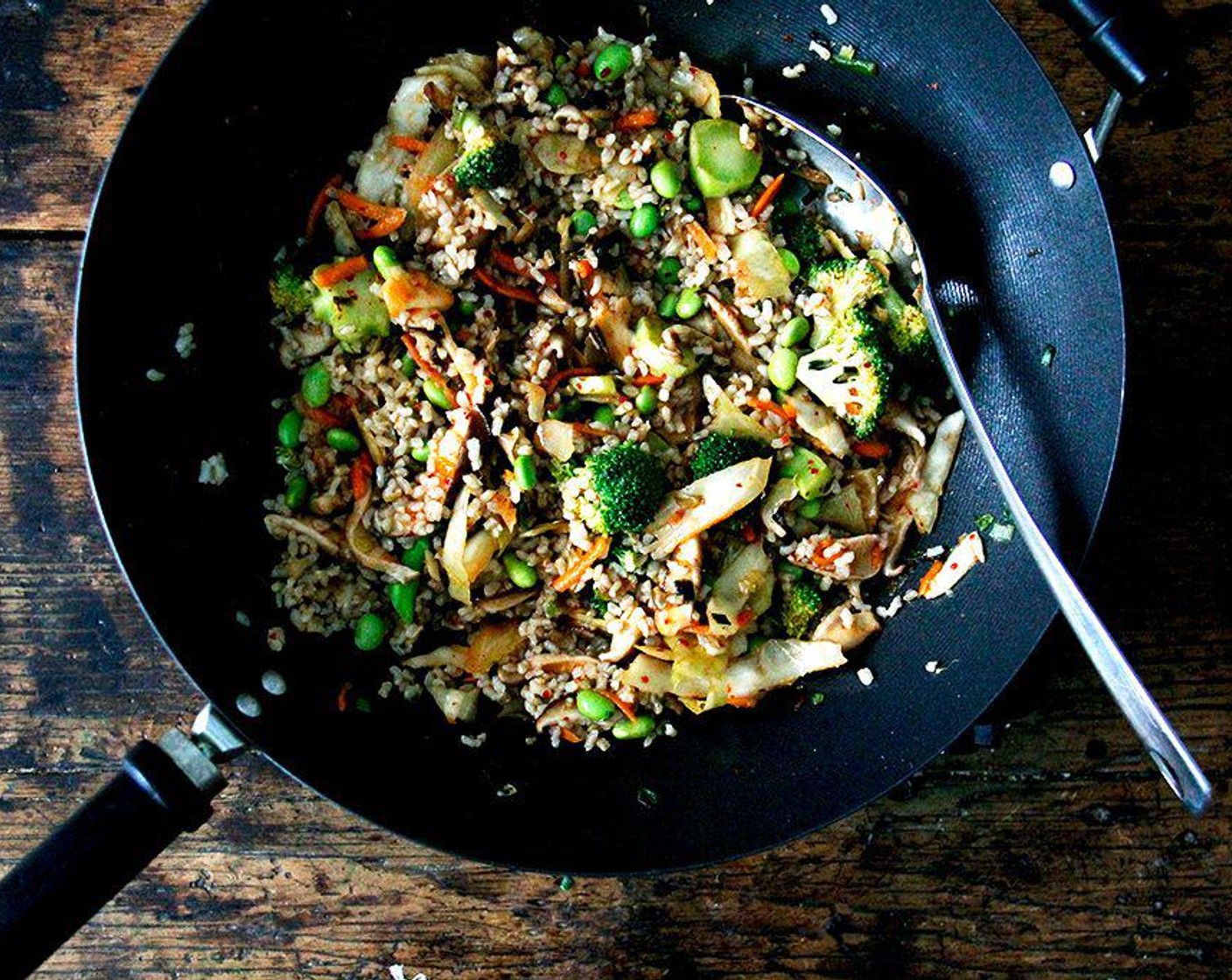 step 4 Stir in the cooked Brown Rice (1 cup), Frozen Shelled Edamame (1 cup), kimchi brine, Toasted Sesame Oil (1 tsp), and Rice Vinegar (2 tsp). Cook, stirring frequently, for about two to three minutes until heated through. Taste and adjust the seasonings if desired. Serve right away with any desired toppings.
