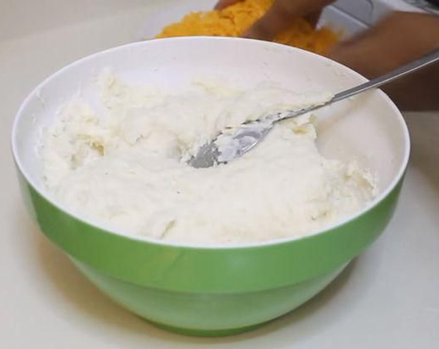 step 3 Melt together the Butter (4 Tbsp) and Milk (1/3 cup). Add to the scooped out potato and mash. Add the Onion Powder (1 tsp), Garlic Powder (1 tsp), Sour Cream (2/3 cup), Salt (to taste), and Ground Black Pepper (to taste) and mix well. Add in some of the Sharp Cheddar Cheese (3/4 cup).