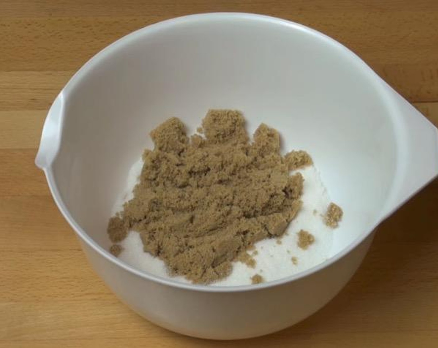 step 1 In a mixing bowl, add Caster Sugar (1/2 cup), Brown Sugar (1/2 cup) and Butter (3 oz). Mix together.