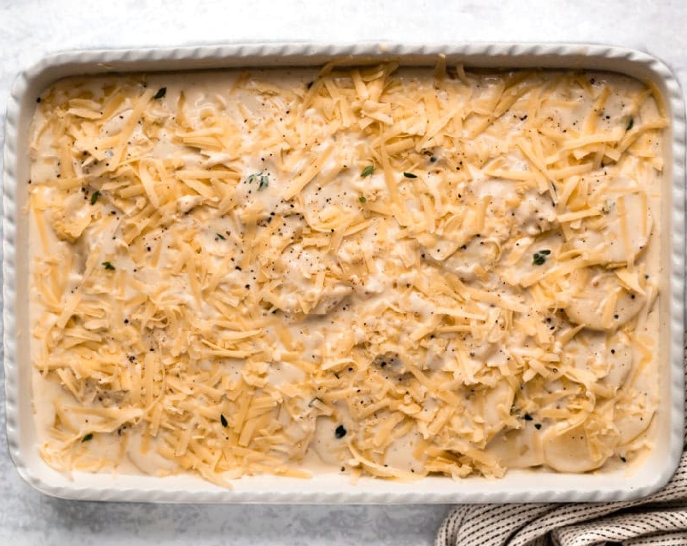 step 5 Use a slotted spoon, to transfer one-third of the potato mixture into the prepared dish. Sprinkle with one-third of Gruyère Cheese (1 1/2 cups). Repeat layering twice more.