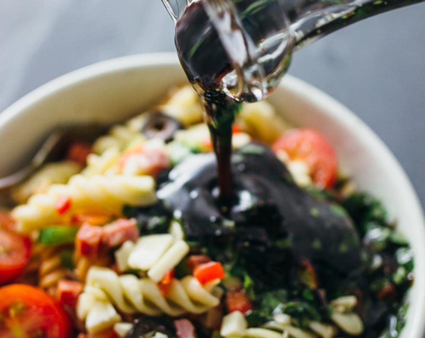 step 3 Mix the Dry Italian Salad Dressing Mix (2 2/3 Tbsp), Olive Oil (3/4 cup), Balsamic Vinegar (1/2 cup), Fresh Oregano (2 Tbsp), Salt (1/4 tsp) and Ground Black Pepper (1/4 tsp) in a small bowl, and pour into the large mixing bowl with the pasta salad.
