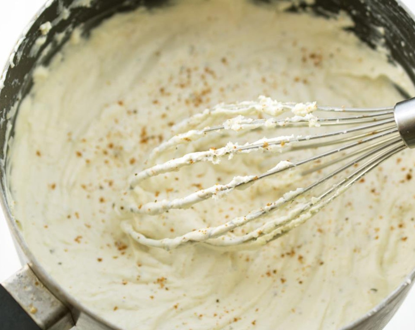 step 2 Heat a medium saucepan and add the Garlic and Herb Gourney Cheese (1 pckg), Cream Cheese (1 cup), Tabasco® Original Red Pepper Sauce (1/4 tsp), Worcestershire Sauce (1/4 tsp), and Old Bay® Seasoning (1 dash).