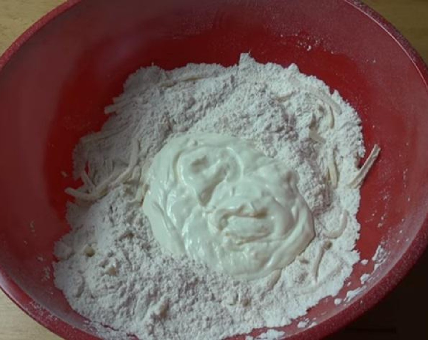 step 1 Inside a mixing bowl, mix together your Self-Rising Flour (2 cups), Cheese (1/2 cup), and Salt (1 pinch). Add the Natural Unflavored Yogurt (4 Tbsp) and mix until a nice and smooth dough forms.