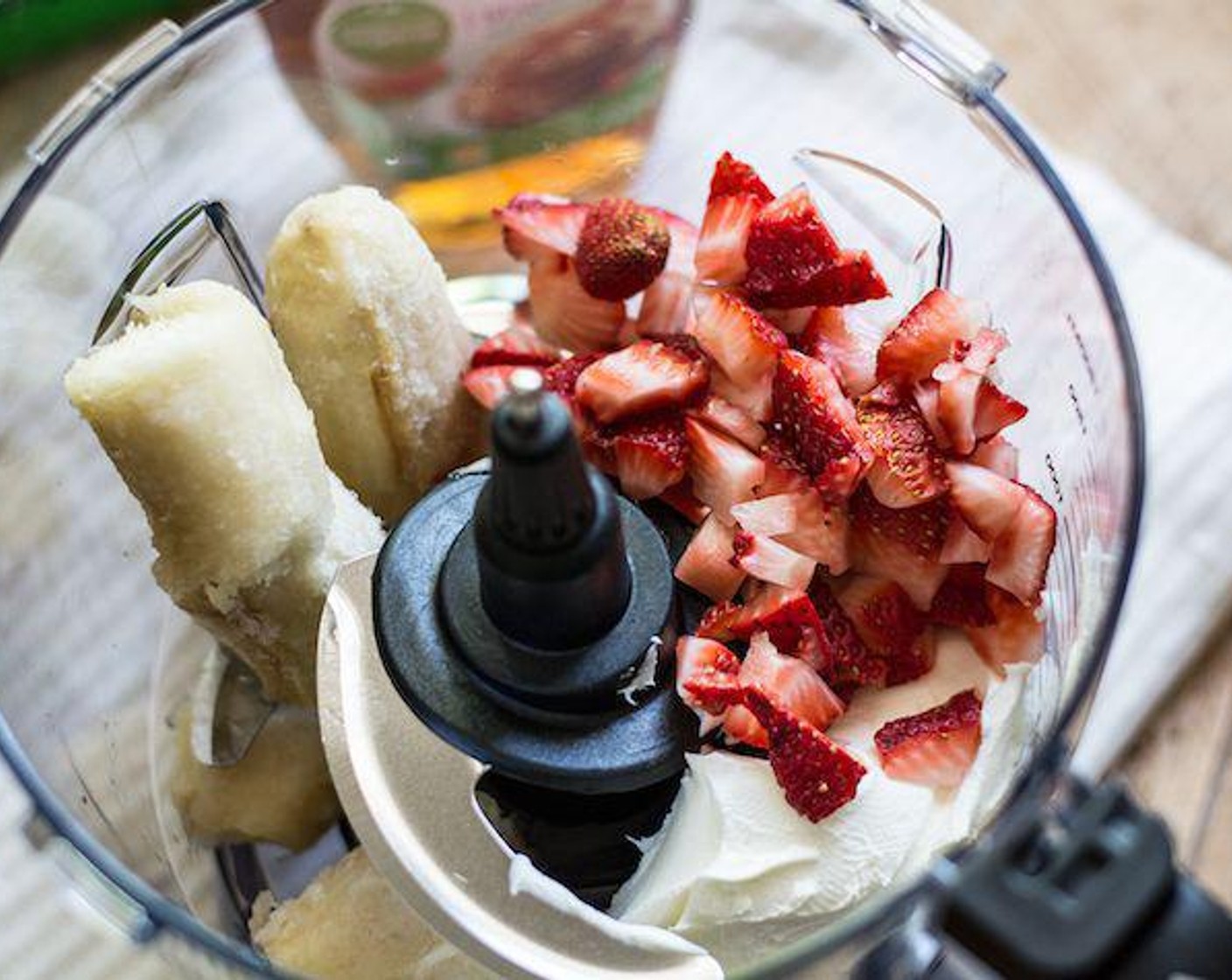step 1 Add Fresh Strawberry (3/4 cup) to a bowl of a food processor, followed by Banana (1), Cream Cheese (1/2 cup), Maple Syrup (2 Tbsp), Whole Milk (4 Tbsp), Organic Sweet Cream Coffee Creamer (4 Tbsp) and the juice from Lemon (1).