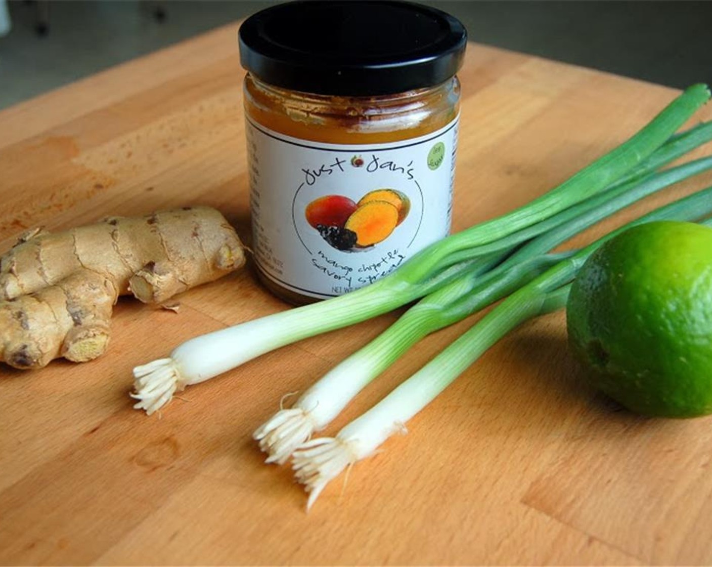 step 2 Combine Just Jan's® Mango Chipotle Spread (1 jar), Fresh Ginger (1 Tbsp), Lime (1), Salt (to taste) and Ground Black Pepper (to taste) in a sauce pan. Heat on low for about five minutes.