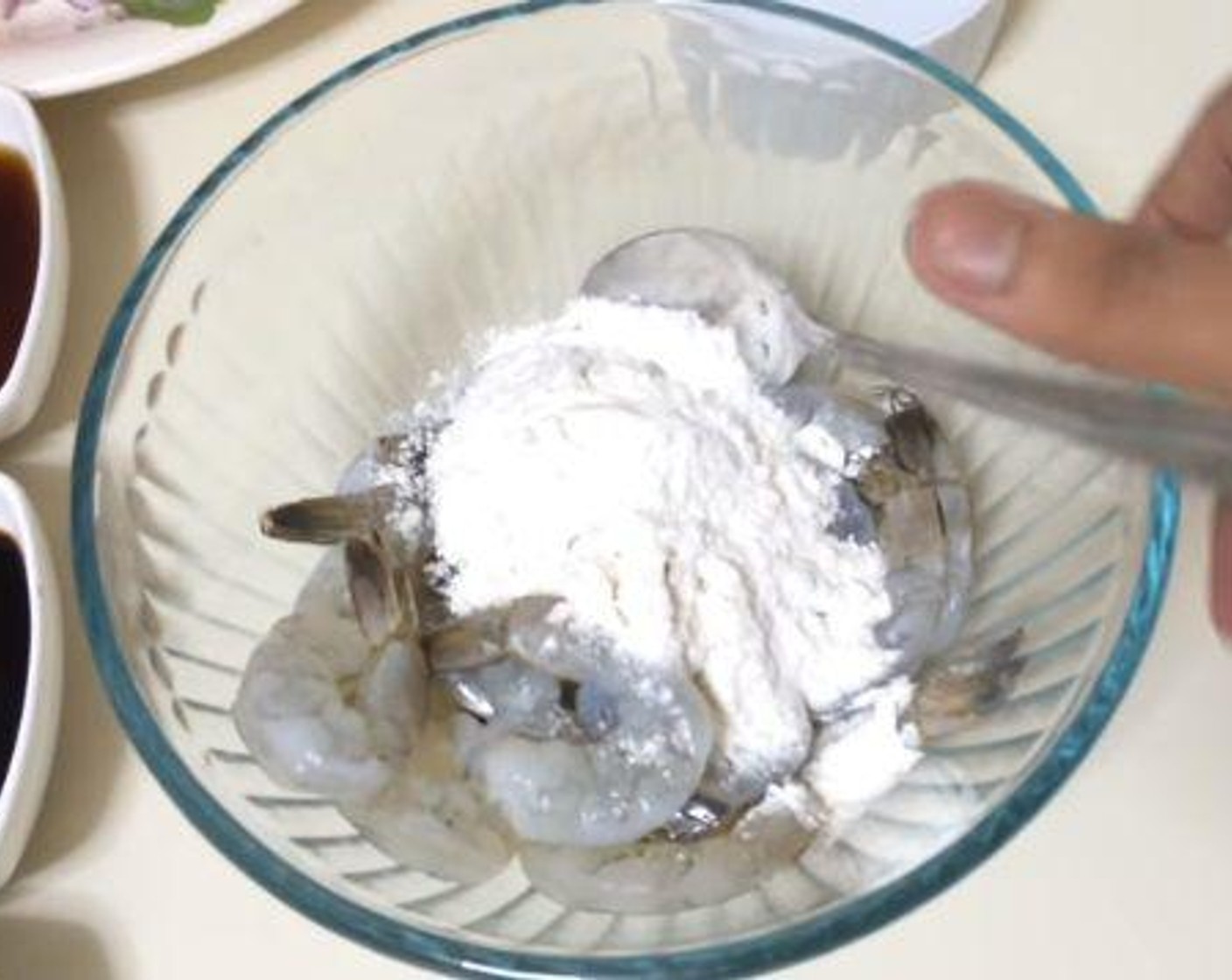 step 1 In a mixing bowl, mix together the Shrimp (1 lb), and All-Purpose Flour (4 Tbsp).