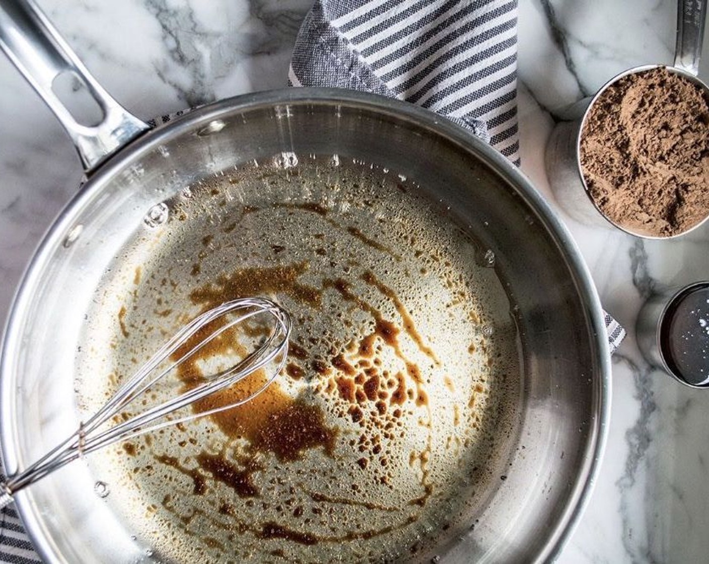 step 1 In a small saute pan, add Refined Coconut Oil (1 cup) and Vanilla Extract (2 tsp). Melt over medium heat, stirring continuously.
