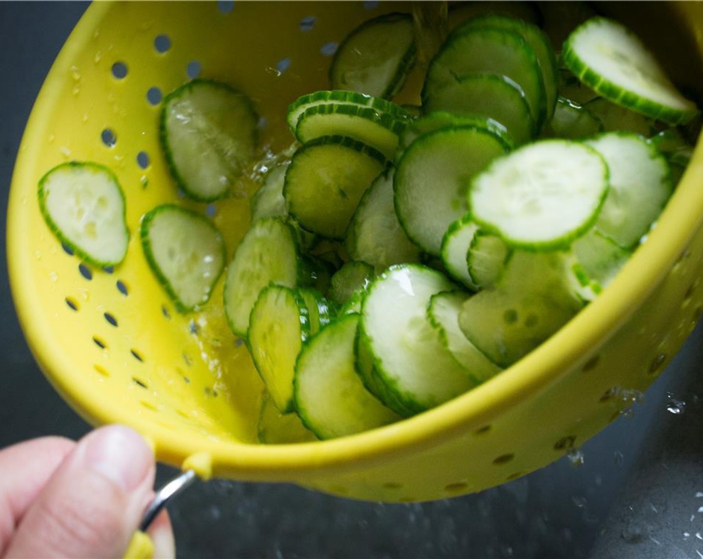 step 4 Rinse the cucumbers well under cold water, making sure to remove all of the excess salt. Allow to drain in the colander while you work on the vinegar mixture.