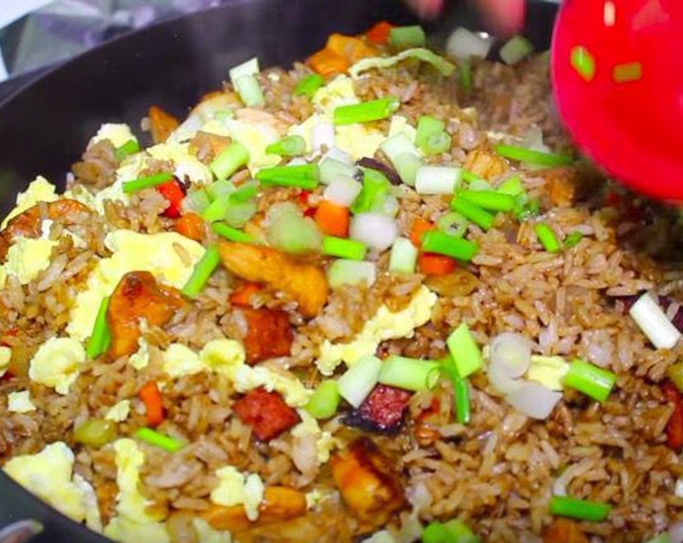 step 7 Add scrambled egg to the rice and toss to combine. Garnish with Scallions (4 Tbsp) and serve.