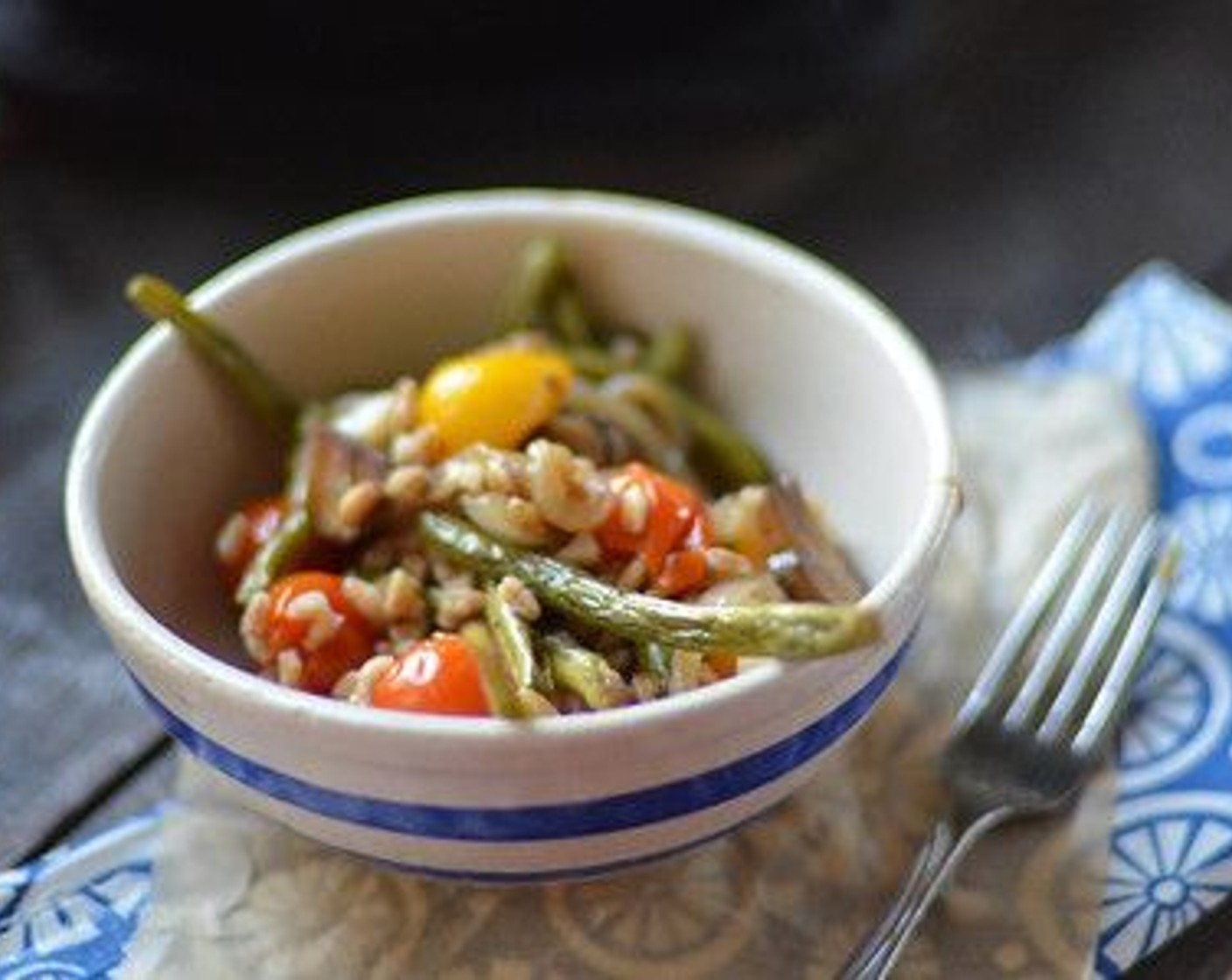 step 9 In a large serving bowl, toss together the beans, cherry tomatoes, onions, mushrooms, and farro. Serve warm.