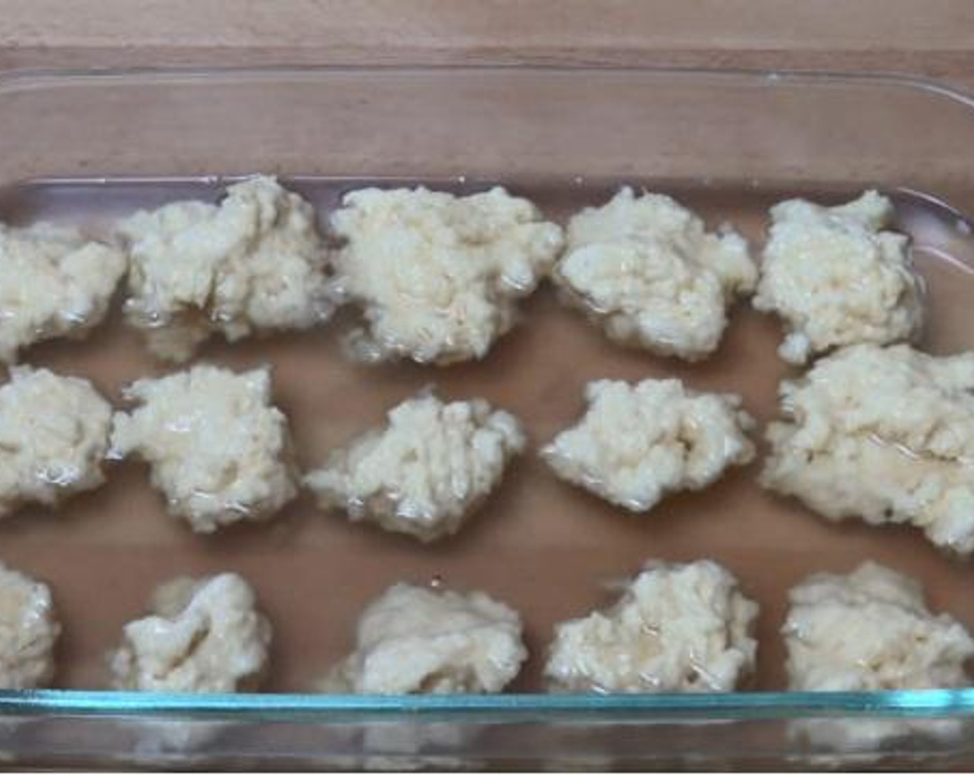 step 4 Gently pour the syrup over the dumplings. Bake inside a preheated oven under 180 degrees C (350 degrees F) for about 30 minutes.