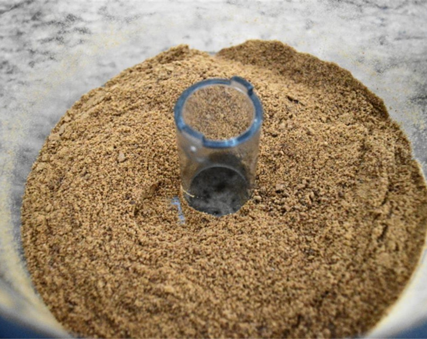 step 3 Mix the cookie crumbs with the Brown Sugar (4 Tbsp), Pumpkin Pie Spice (1 tsp), Ground Cinnamon (1/2 tsp), Ground Nutmeg (1/2 tsp), and Butter (1/3 cup).