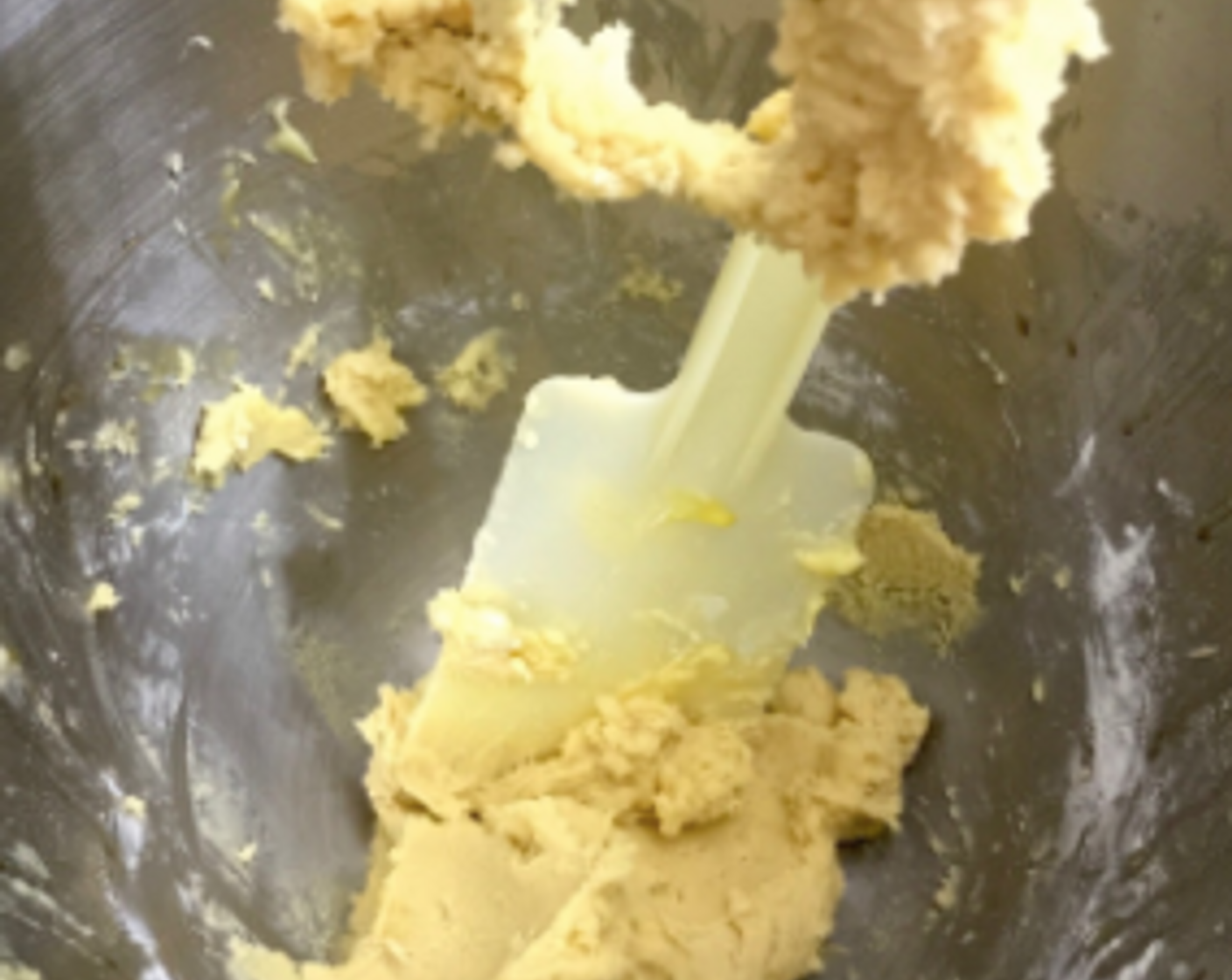 step 13 Beat the flour mixture until a batter is formed. Scape down the sides. And we're done with the cookie dough.