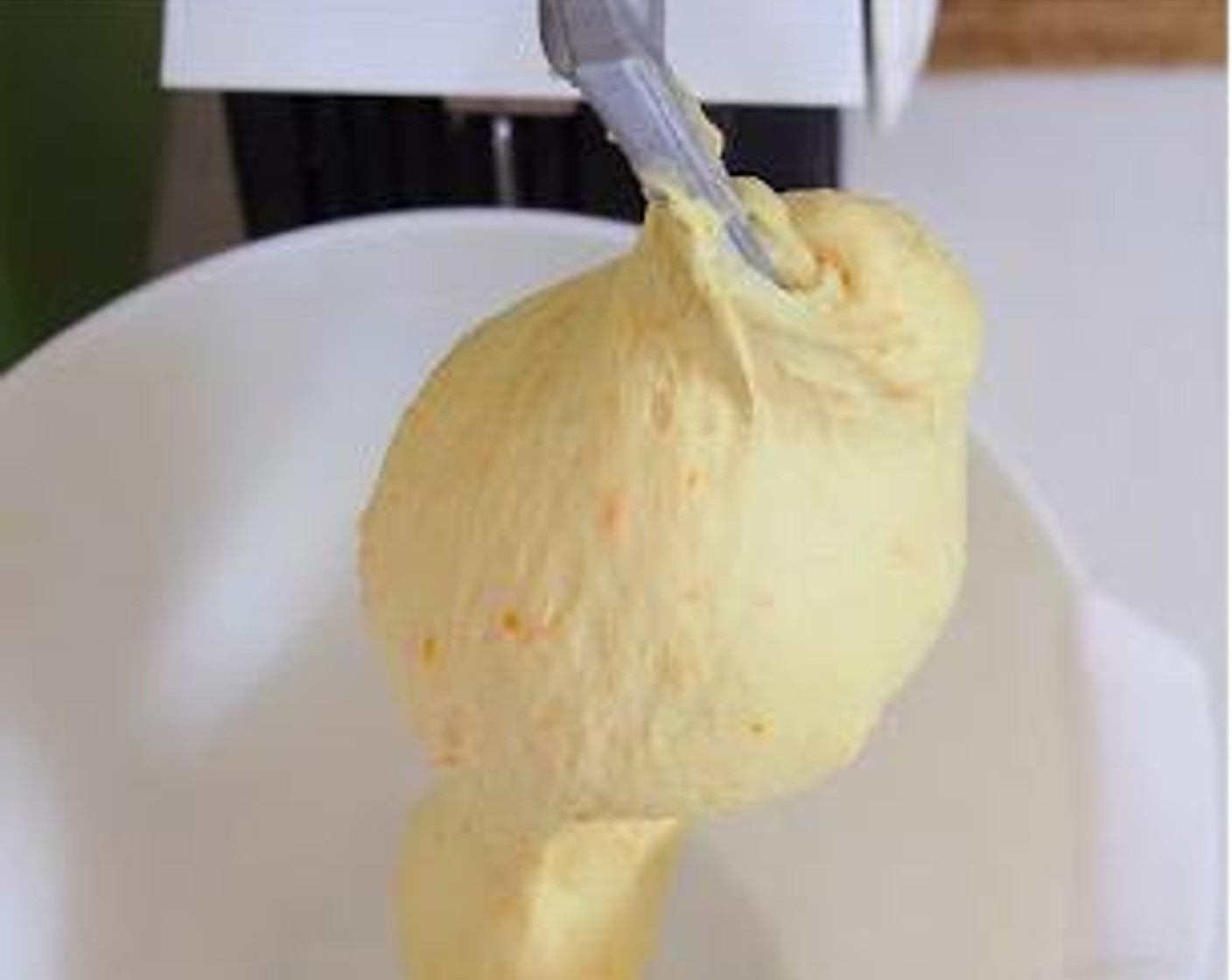 step 6 Put Salt (1 tsp), Bread Flour (2 cups), Instant Dry Yeast (1 tsp), Brown Sugar (3 Tbsp), Butter (1.5 oz), 45 grams of the whisked egg, Milk (5 oz), Vanilla Extract (1 tsp) and sponge dough into the bowl of stand mixer. Using the dough hook on a stand mixer, knead until the dough comes together and become elastic and tacky but not sticky, about 15 minutes.