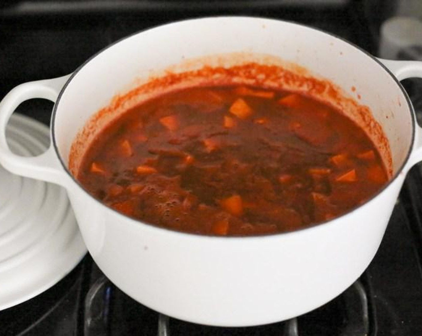step 2 Add the Smoked Paprika (1 tsp) and Ground Cumin (1/2 tsp) and cook for 1 minute to get the spices nice and toasty. Add the Chipotle Peppers in Adobo Sauce (1), Adobo Sauce (1 Tbsp), Sweet Potato (1), Canned Black Beans (2 1/3 cups), Canned Tomato Purée (1 2/3 cups) and Low-Sodium Vegetable Stock (3 cups) to the pot.