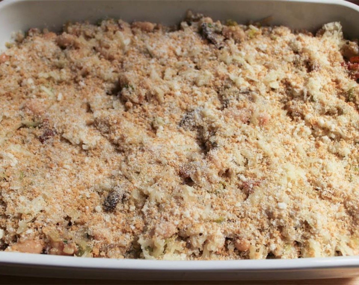 step 16 In a small bowl, combine the Whole Wheat Panko Breadcrumbs (4 Tbsp) and Parmesan Cheese. Sprinkle the mixture in an even layer over the casserole.