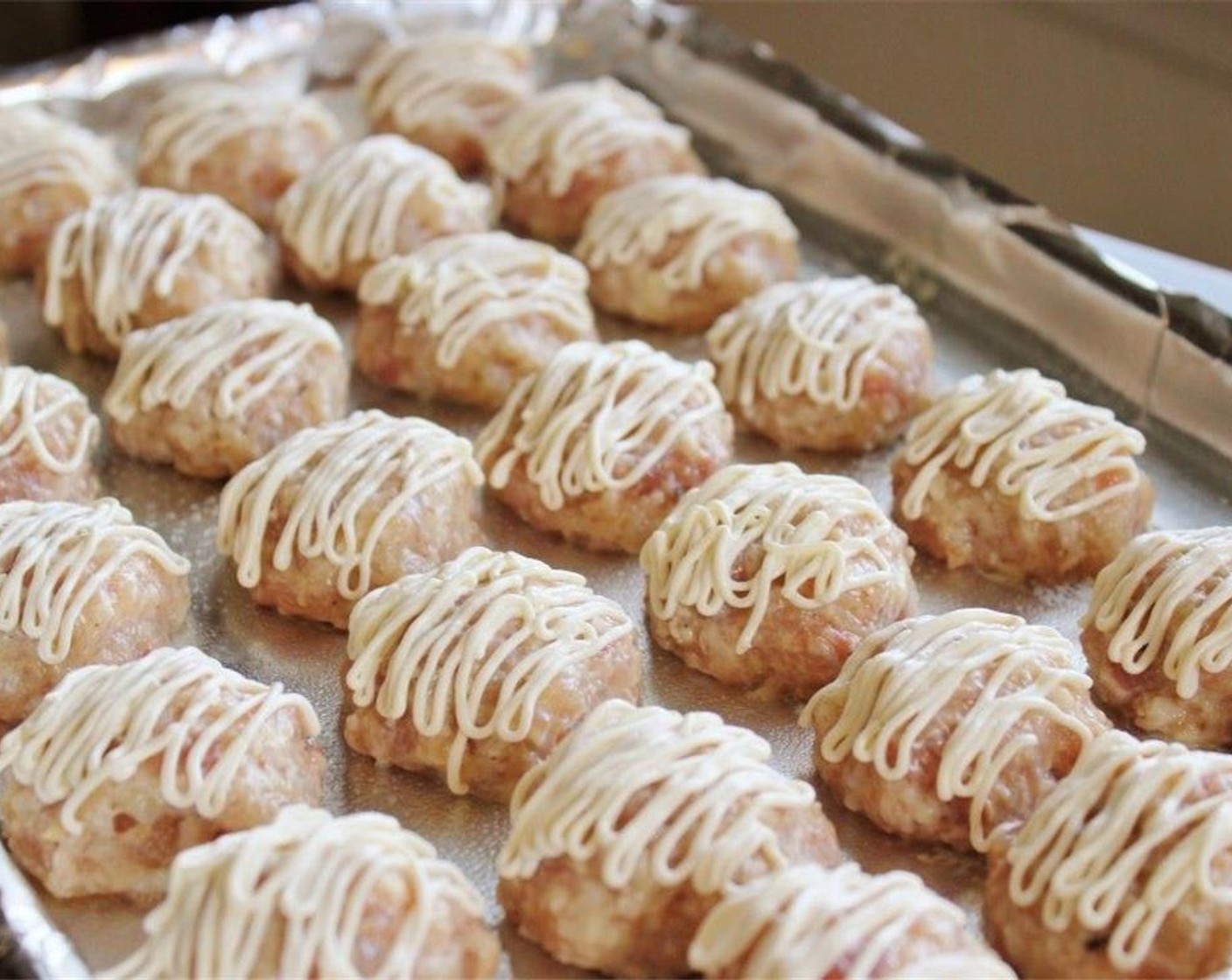 step 9 Apply the Mayonnaise (4 Tbsp) evenly on the top of each meatball.