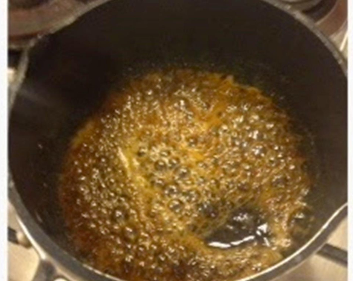 step 3 Put the mochi into the prepared ice water. Meanwhile, combine the Brown Sugar (1 Tbsp) and Water (1 Tbsp) together and bring to a boil. Then turn to low heat and simmer until it reaches a syrup texture.