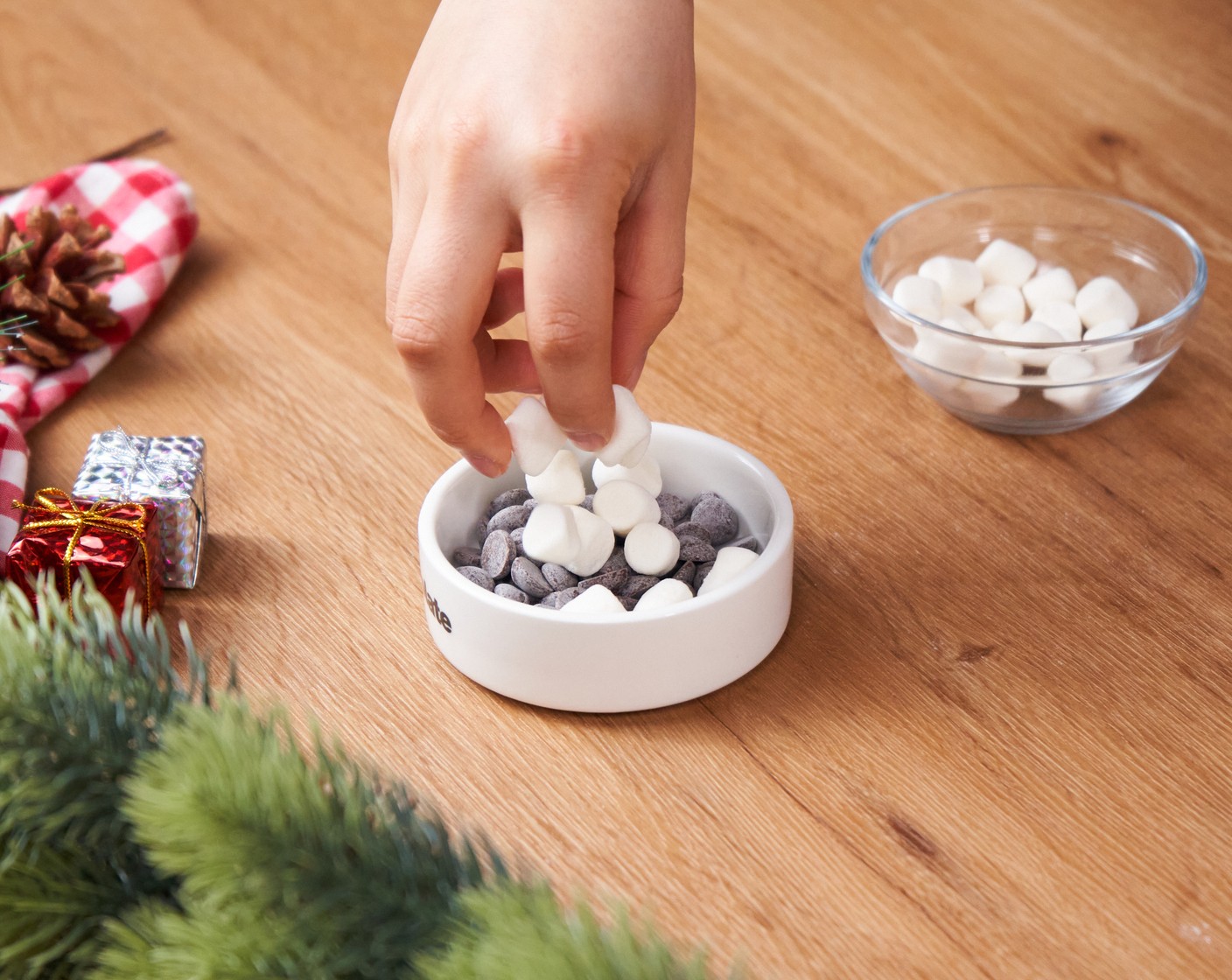 step 2 Place the Dark Chocolate (2 Tbsp) into a shallow oven-safe ramekin, and sprinkle Mini Marshmallows (4 Tbsp) on top. Bake in the oven for 5-8 minutes or until the top of the marshmallows is golden brown.