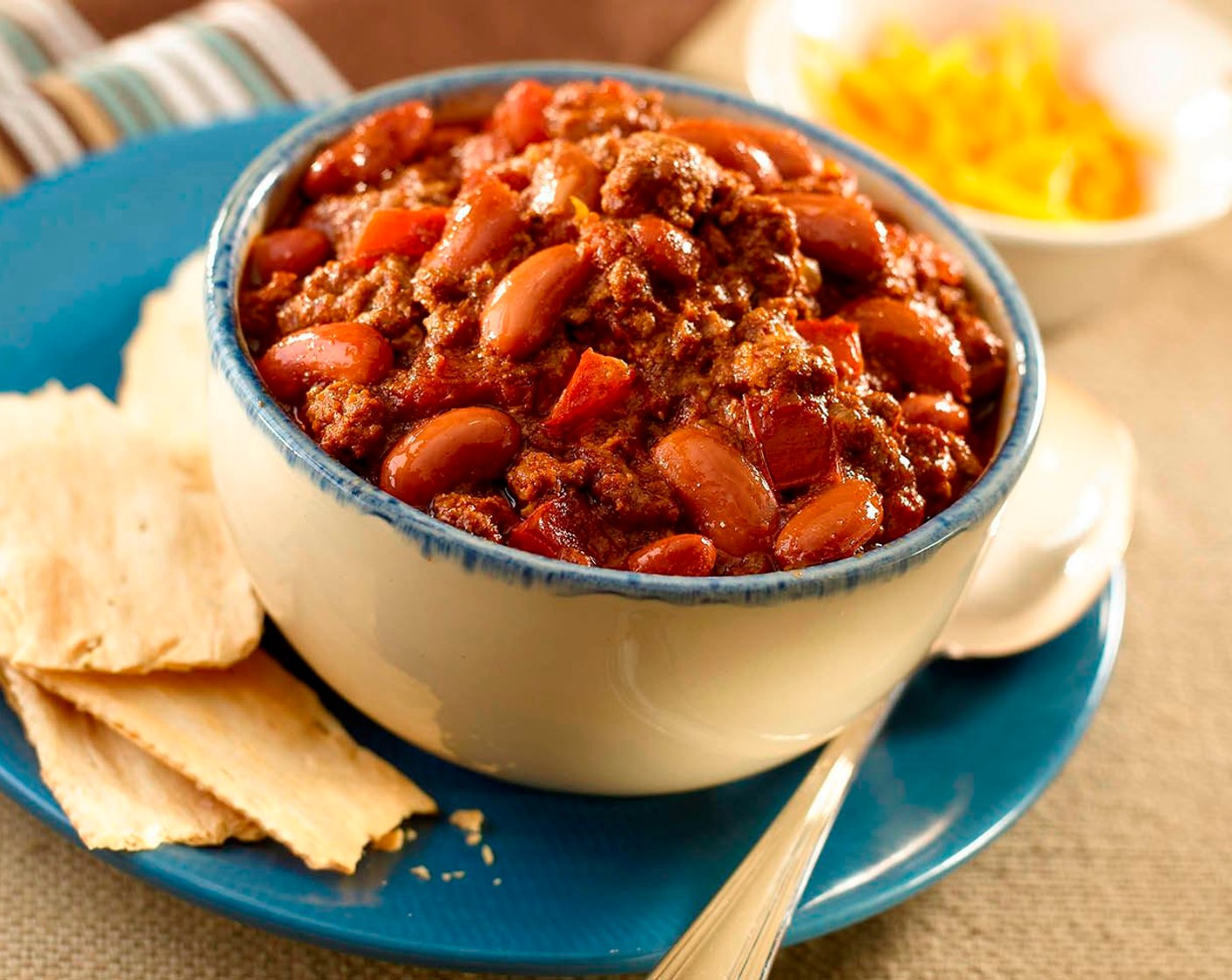 step 2 Stir reserved beans into meat mixture. Cook until heated through, about 10 minutes more. Stir in Granulated Sugar (1/2 tsp); season with Adobo Seasoning (to taste). Divide chili evenly among serving bowls. Garnish with Mexican Style Hot Sauce (to taste), if desired.