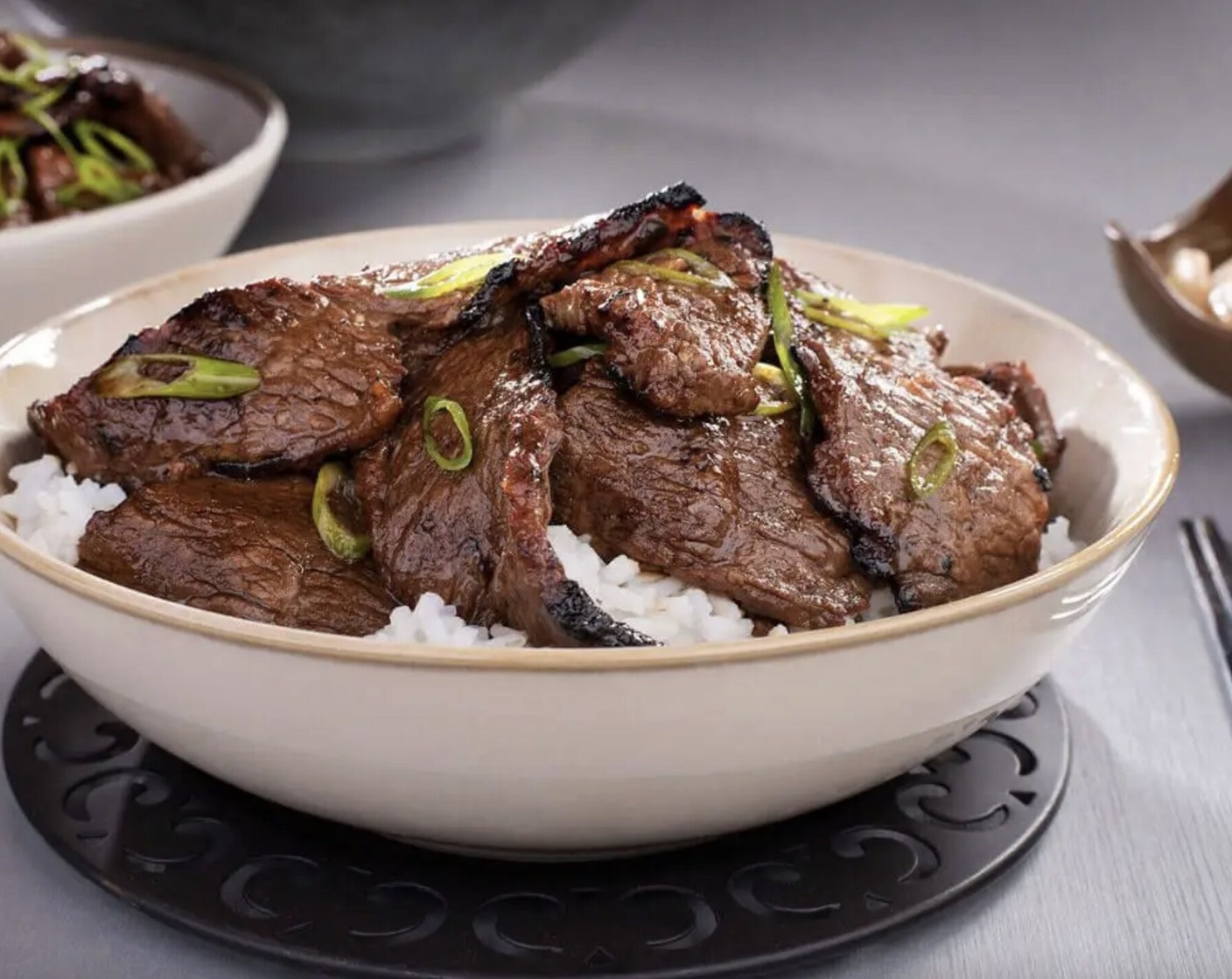 step 3 Remove short ribs from marinade (discarding marinade) and pat dry. Sear short ribs in a hot skillet in Canola Oil (2 Tbsp) for 1 to 2 minutes per side, transfer to a clean plate and garnish with sliced scallion greens.