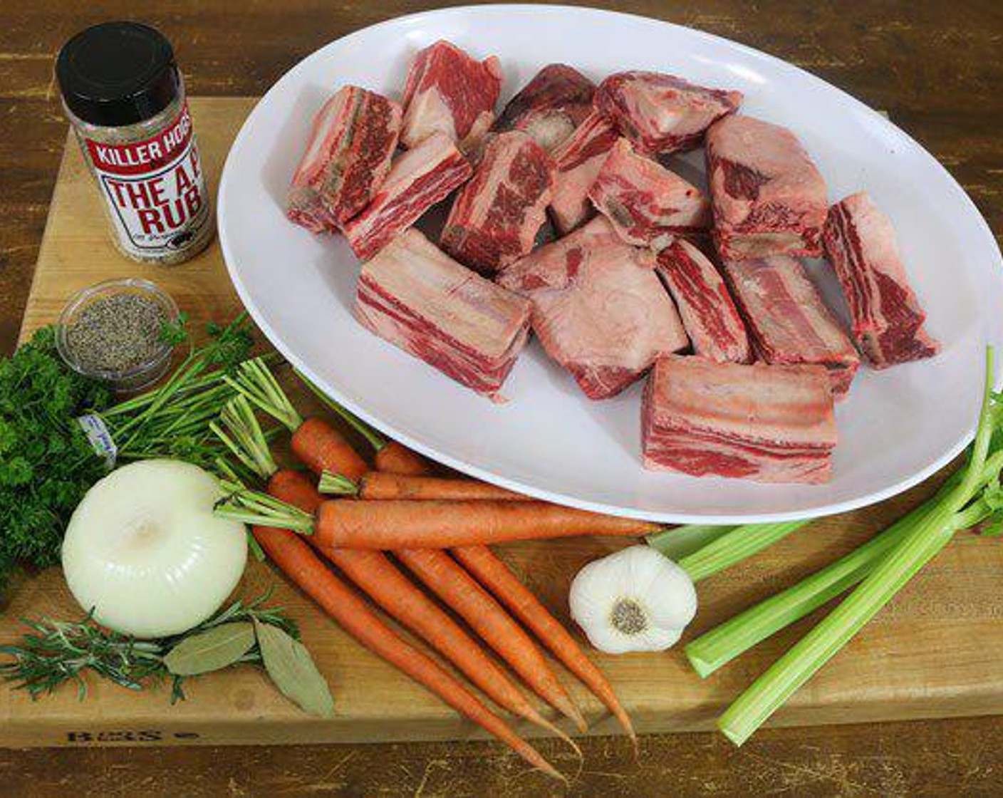 step 3 Chop Carrots (3), Celery (3 stalks), and Onion (1) into large chunks. Place in a full size steam pan. Smash Garlic (8 cloves) and add to pan. Pour in Beef Stock (4 cups) and Red Wine (2 cups). Add Tomato Paste (2/3 cup) and stir to disperse. Season with All-Purpose Spice Rub (4 Tbsp) and add Fresh Rosemary (2 sprigs) and Bay Leaf (1).