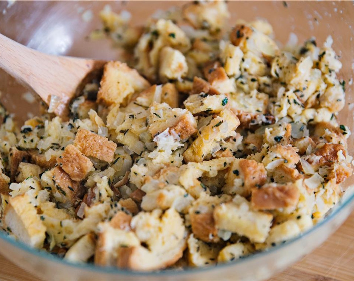 step 10 Pour stock and egg mixture over the bread, herbs and onions.