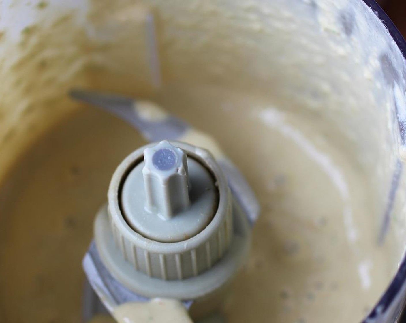 step 7 To make the Peanut Sauce, cut the Jalapeño Pepper (1)  in half and remove the seeds. Place the Peanut Butter (4 Tbsp), jalapeno, a Garlic (1 clove), juice from the rest of the lime, Low-Fat Coconut Milk (2 Tbsp) and a tablespoon of water in the food processor. Pulse until the jalapeño and garlic are chopped up and everything is well mixed together and incorporated.