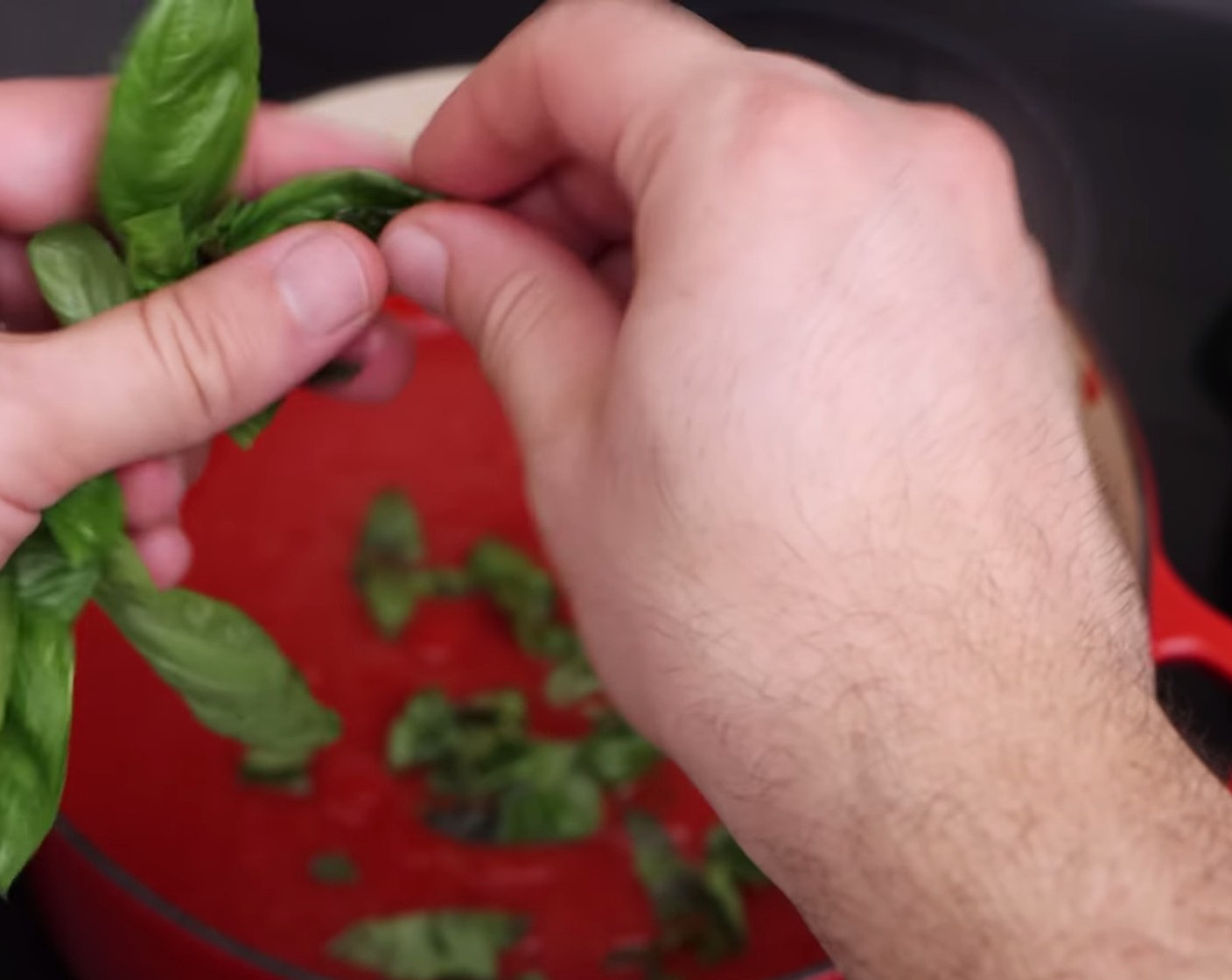 step 8 Once the sauce for your pasta al forno is ready, remove the lid and add some Fresh Basil Leaves (to taste) to it and stir gently, but really well.