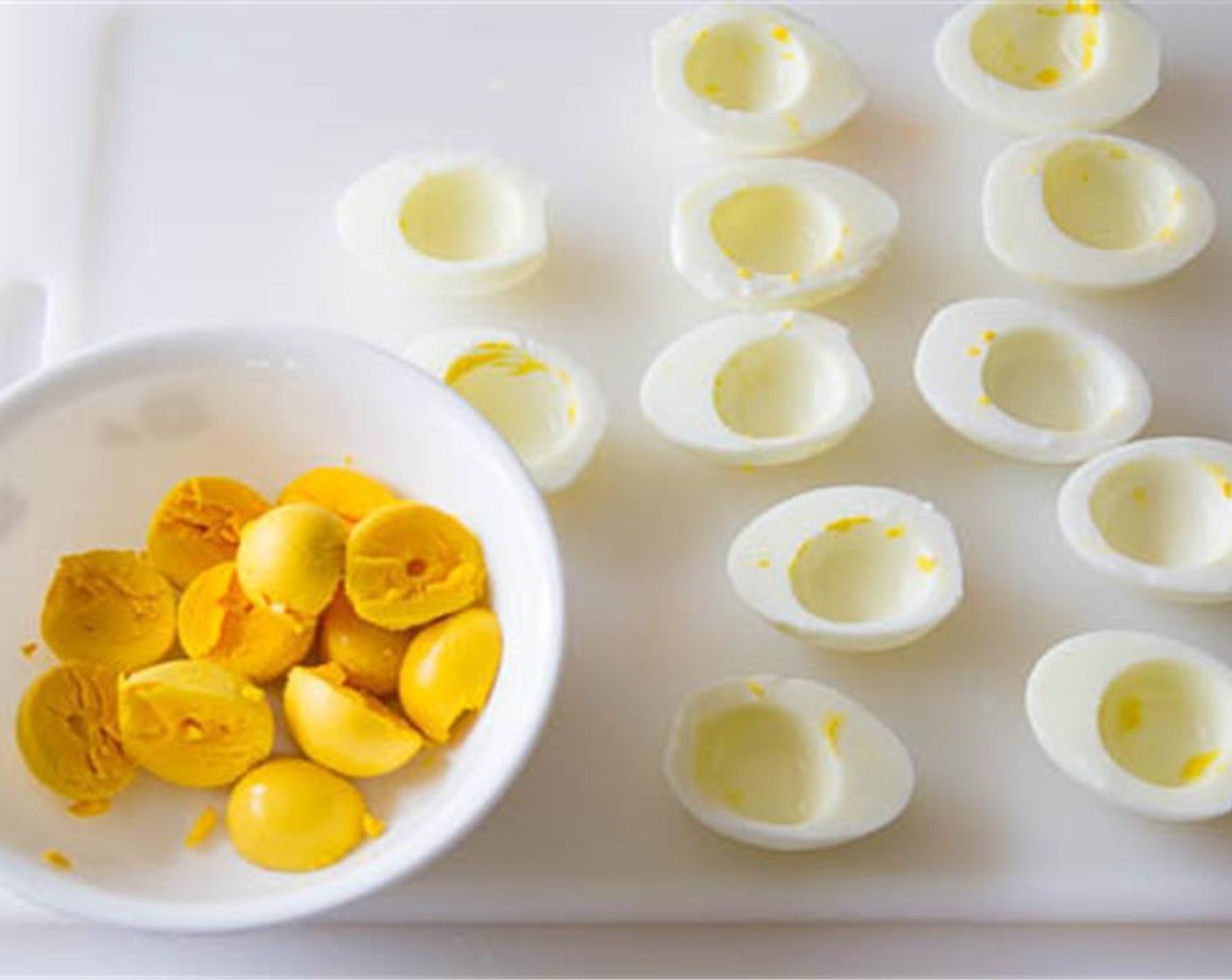 step 5 Then peel the eggs, cut in half and separate the egg yolks.