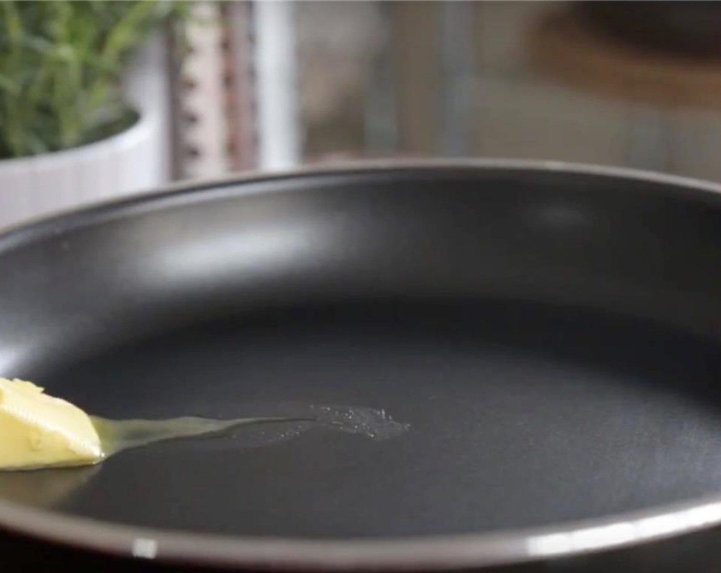 step 2 Heat a small non-stick skillet over medium. Slide in half of Unsalted Butter (1 tsp)