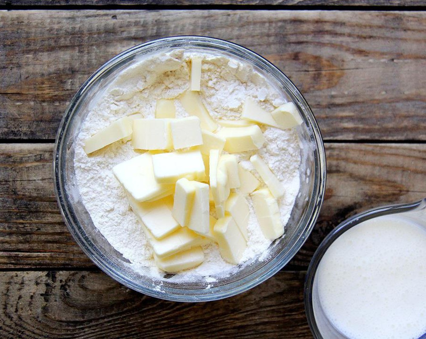 step 4 Meanwhile, whisk the All-Purpose Flour (1 cup), Granulated Sugar (4 Tbsp), Baking Powder (2 tsp), Baking Soda (1/4 tsp) and Salt (1/4 tsp) in a large bowl to combine. Cut Unsalted Butter (4 Tbsp) into small pieces and use your fingers to incorporate the butter into the mixture — it's ok if the butter gets soft.