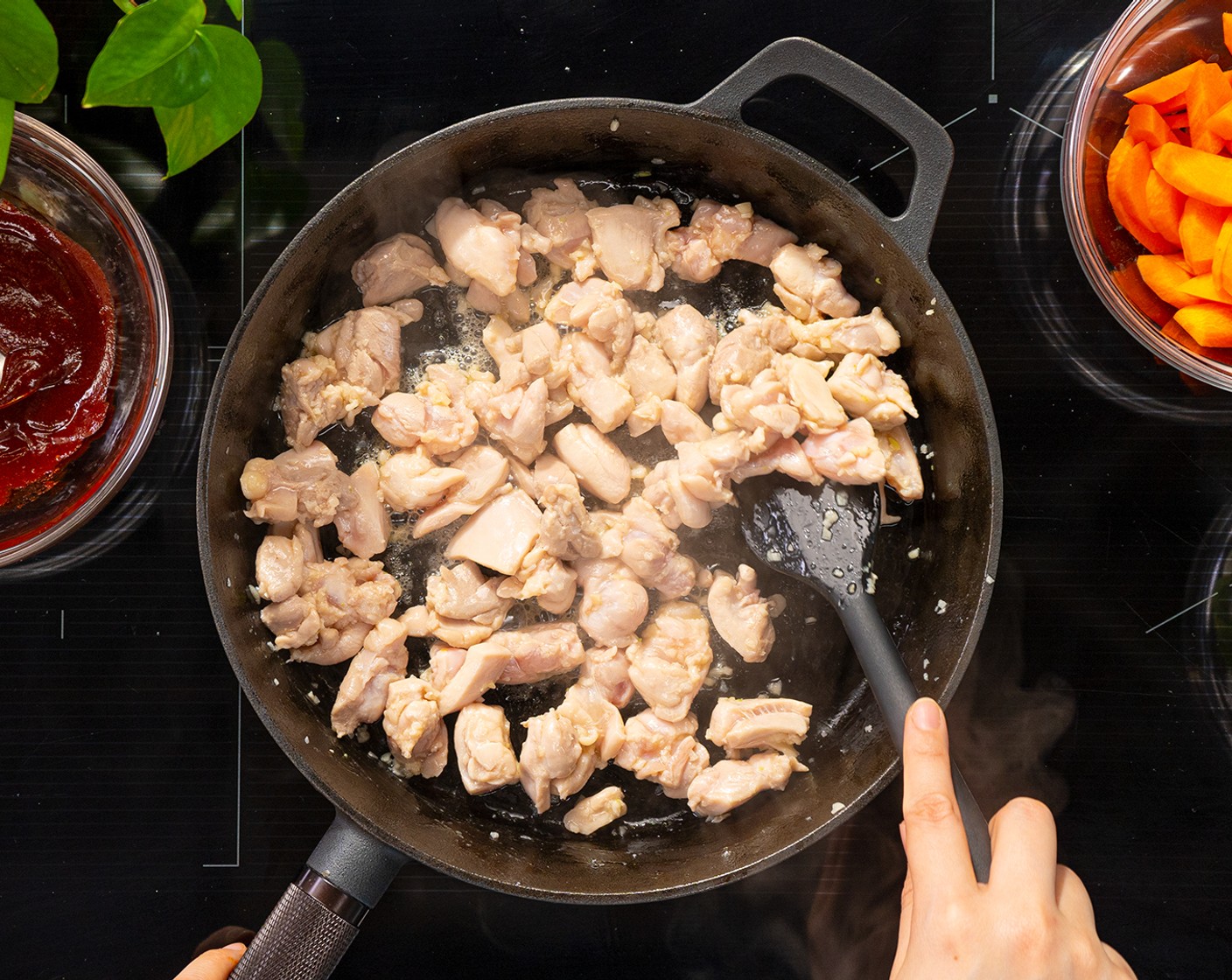 step 4 In a wok or large skillet over medium-high heat, add Vegetable Oil (1 tsp). Once hot, add Garlic (2 cloves) and cook until fragrant. Then add chicken thighs and cook for 2-3 minutes.