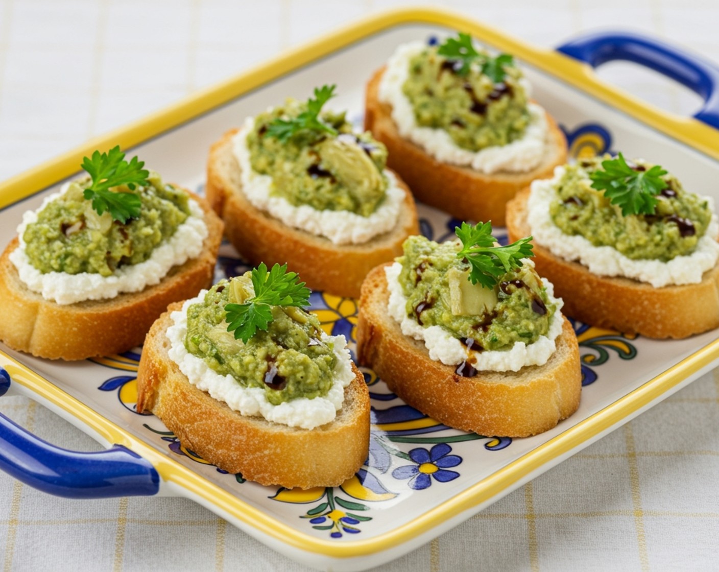step 6 Assemble the crostinis by spreading a layer of whipped ricotta, followed by a dollop of artichoke pesto. If desired, drizzle with a bit of balsamic glaze.
