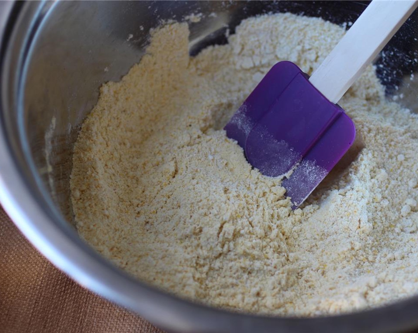 step 2 Mix the dry ingredients: Corn Flour (1 cup), Cornmeal (1 cup) and Baking Powder (2 tsp). In a separate bowl, mix the wet ingredients: Canola Oil (4 Tbsp), Maple Syrup (2 Tbsp), and Non-Dairy Milk (1 cup).