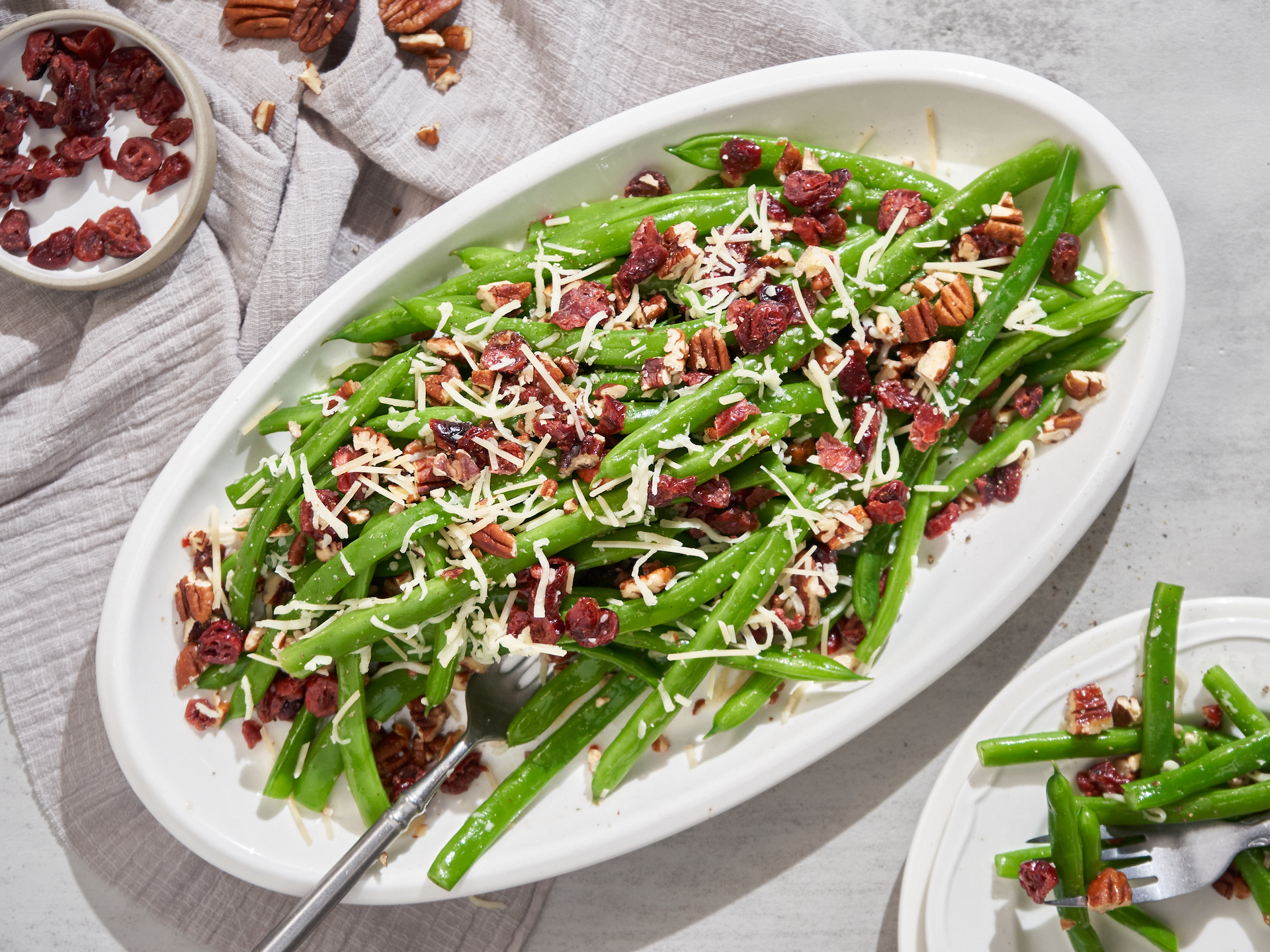 Vibrant green bean salad with cranberries and toasted pecans
