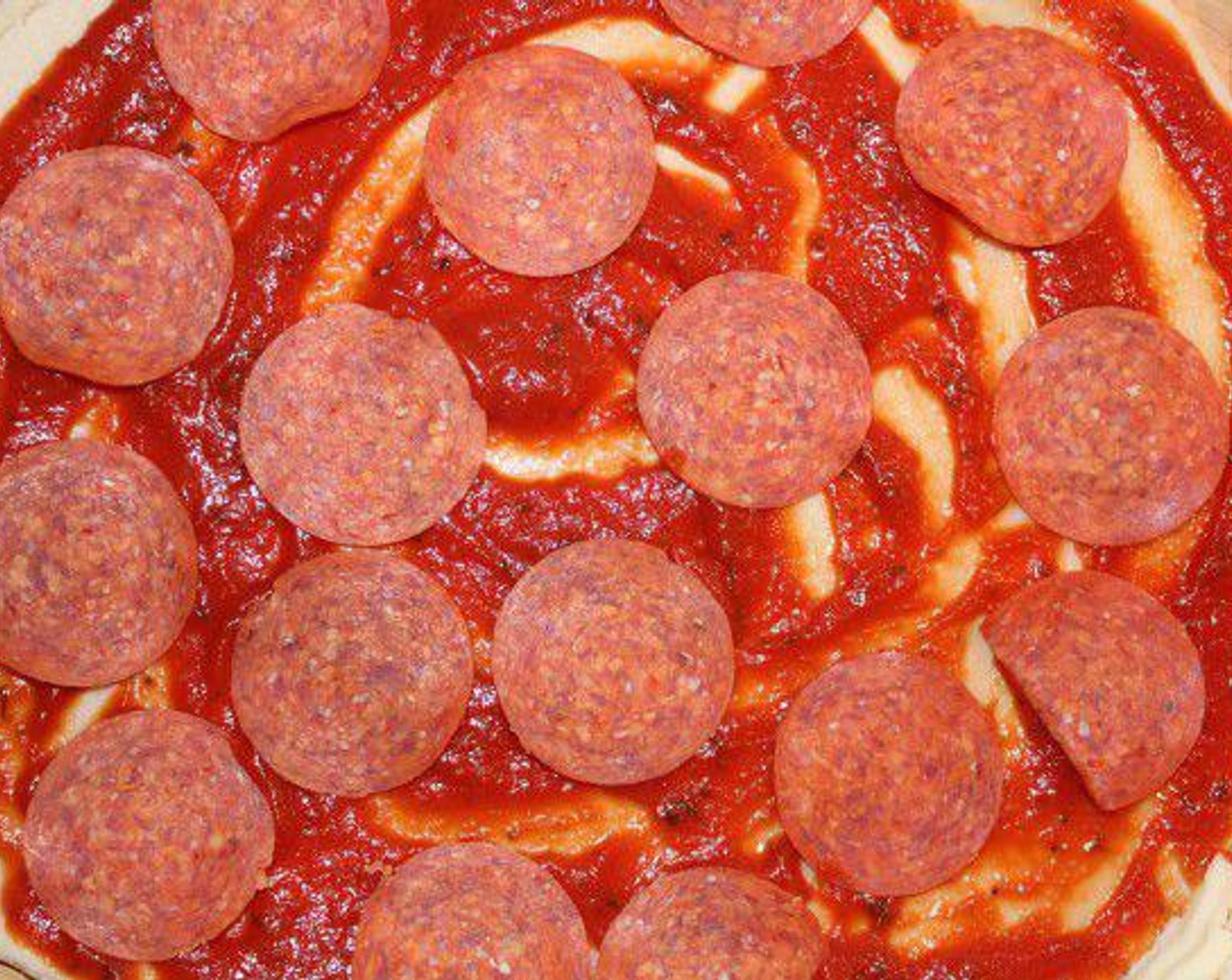 step 1 Roll out the Pie Crust (1 pckg), and spread the bottom crust with the Marinara Sauce (1/2 cup). Then add the Pepperoni Slices (to taste) or any fillings of your choice.