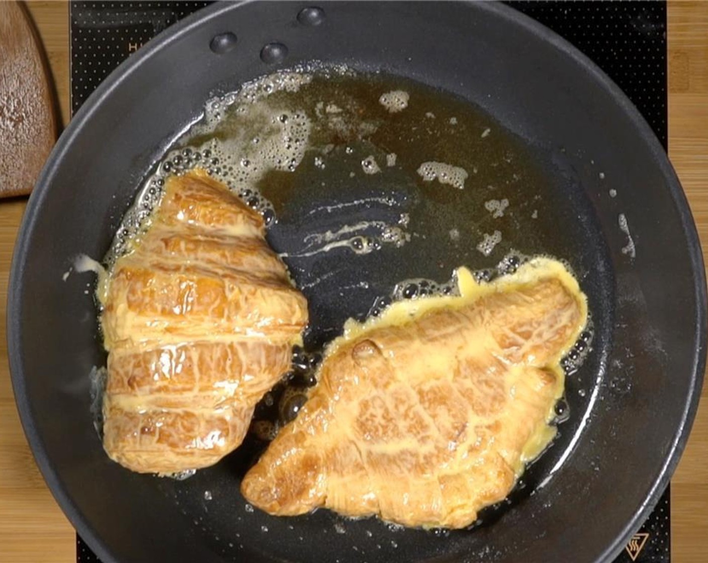 step 3 Slice the Croissants (24) in half lengthwise. Working in batches, submerge and soak the halves in eggnog mixture for a minute. Cook in a greased pan or hot griddle over medium heat until golden brown on both sides and cooked through for about 3 to 4 minutes per side.