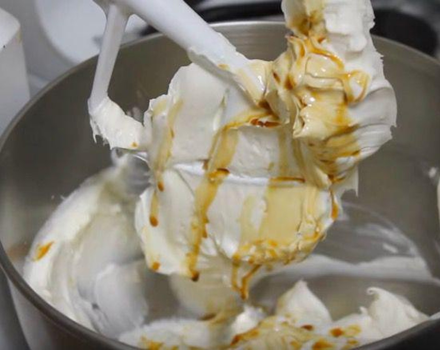 step 4 Using a stand mixer or electric mixer, beat Cream Cheese (2 pckg) and Granulated Sugar (3/4 cup) until smooth. Then add the Large Eggs (2) and Pure Vanilla Extract (2 tsp). Keep on mixing until everything is well combined.