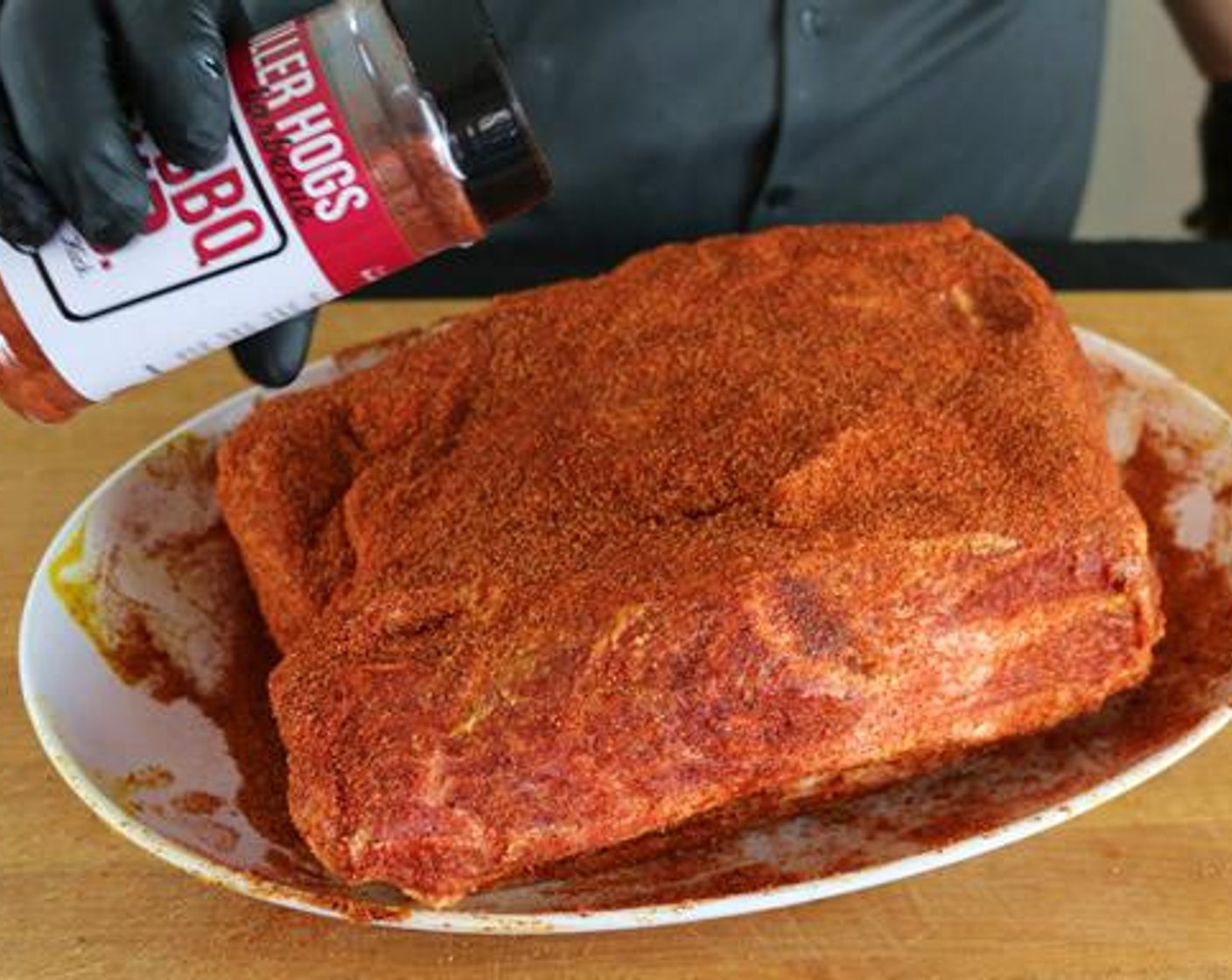 step 1 Pat dry the Boneless Pork Shoulder (8 lb). Coat with Yellow Mustard (3 2/3 Tbsp) and Barbecue Rub (1 cup).