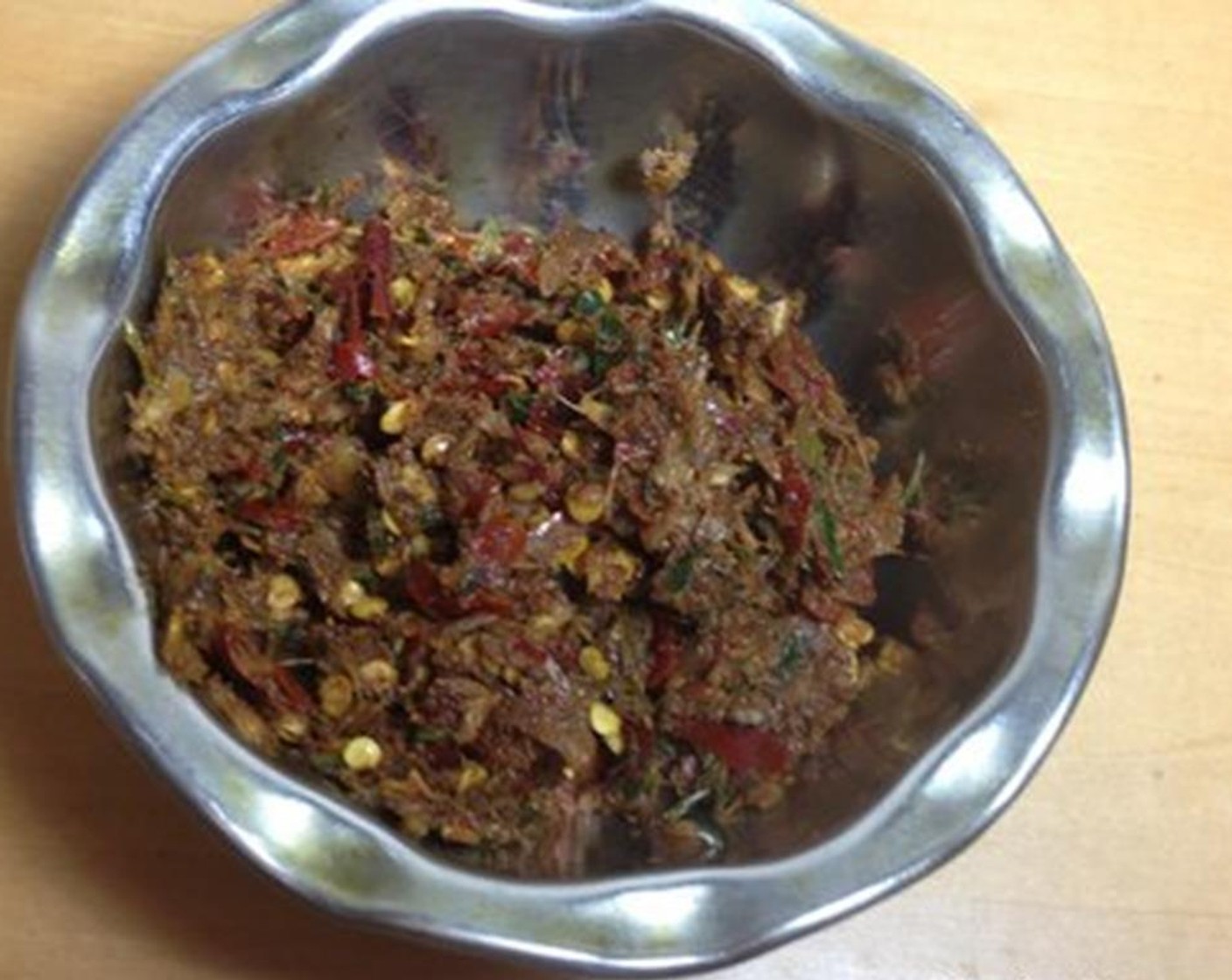 step 5 Crush together Red Chili Peppers (6), Garlic (1 clove), Fresh Ginger (1 Tbsp), Garam Masala (1 tsp), Lemon (1), Cumin Seeds (1 tsp) and Salt (to taste).