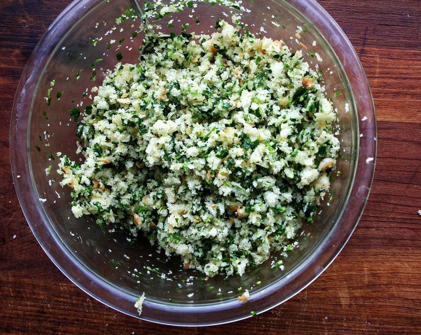step 6 Meanwhile, melt the remaining Unsalted Butter (4 Tbsp) on a stovetop or in microwave. Pulse Bread (6 oz) in food processor to make crumbs. Measure 3 cups and place in a large bowl. Add Fresh Parsley (1 bunch) and Garlic (2 cloves) to food processor. Pulse until fine, then add to bowl with breadcrumbs. Season with Kosher Salt (1/4 tsp). Pour melted butter over top and mix with spatula until combined.