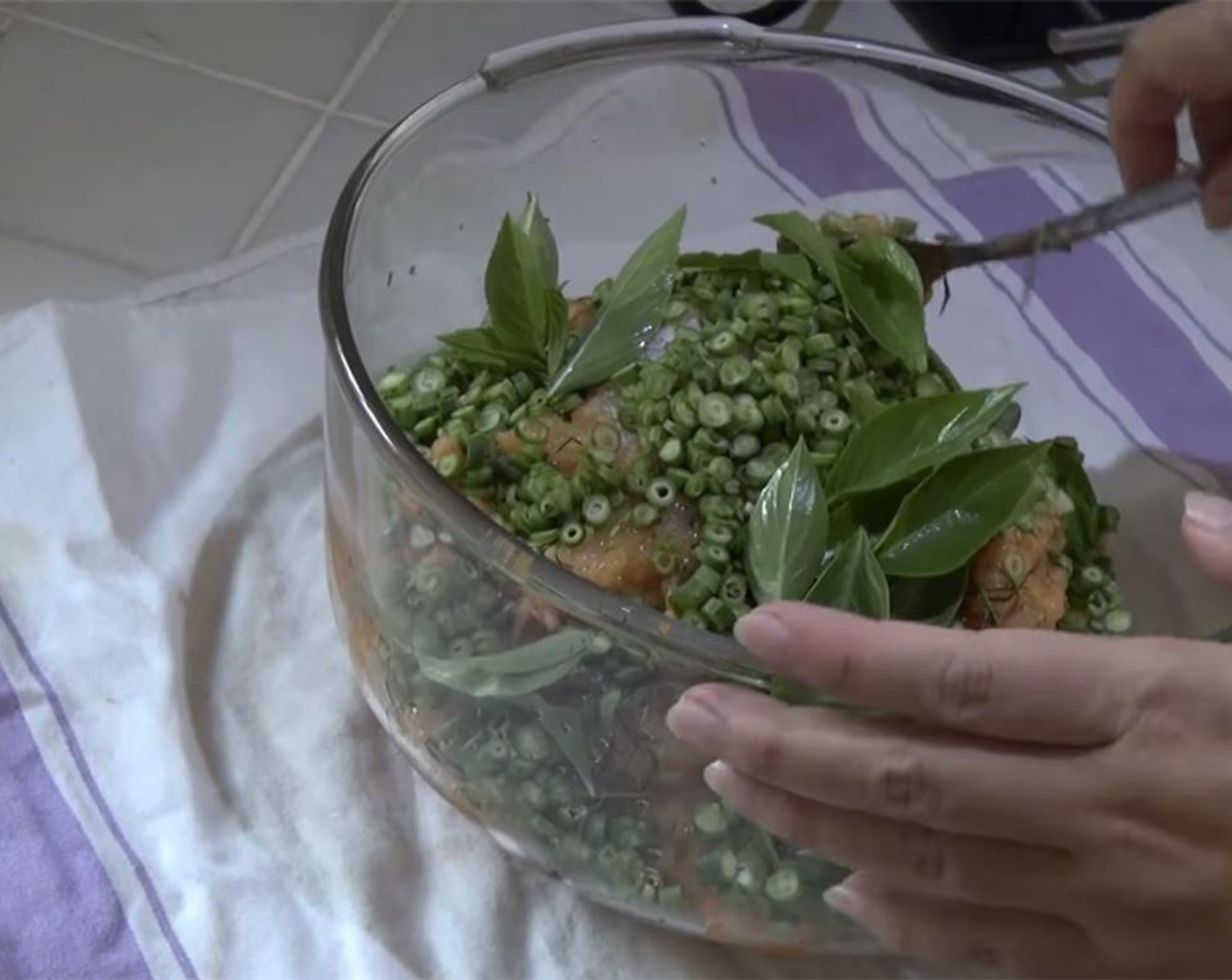 step 2 Into a bowl, mix the tilapia, Fish Sauce (1 tsp), Granulated Sugar (1 Tbsp), Green Beans (1 cup), Kaffir Lime Leaves (2 Tbsp), and Fresh Thai Basil Leaves (1 cup). The fish has to be wet. If on the dry side mix in the Egg (1).