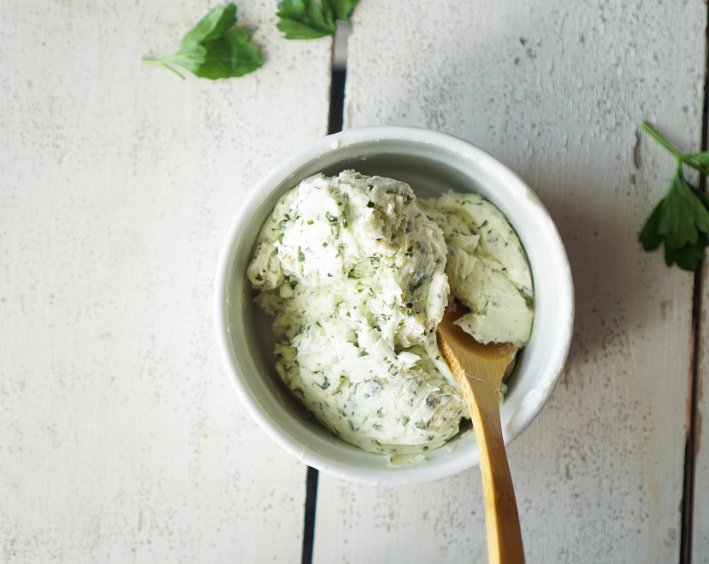 step 9 Prepare the butter. Mix together the Butter (1/3 cup), Fresh Parsley (2 Tbsp), juice of the Lemon (1), and Ground Black Pepper (1/4 tsp) until the herbs are evenly distributed. This can be done in a processor or stand mixer.