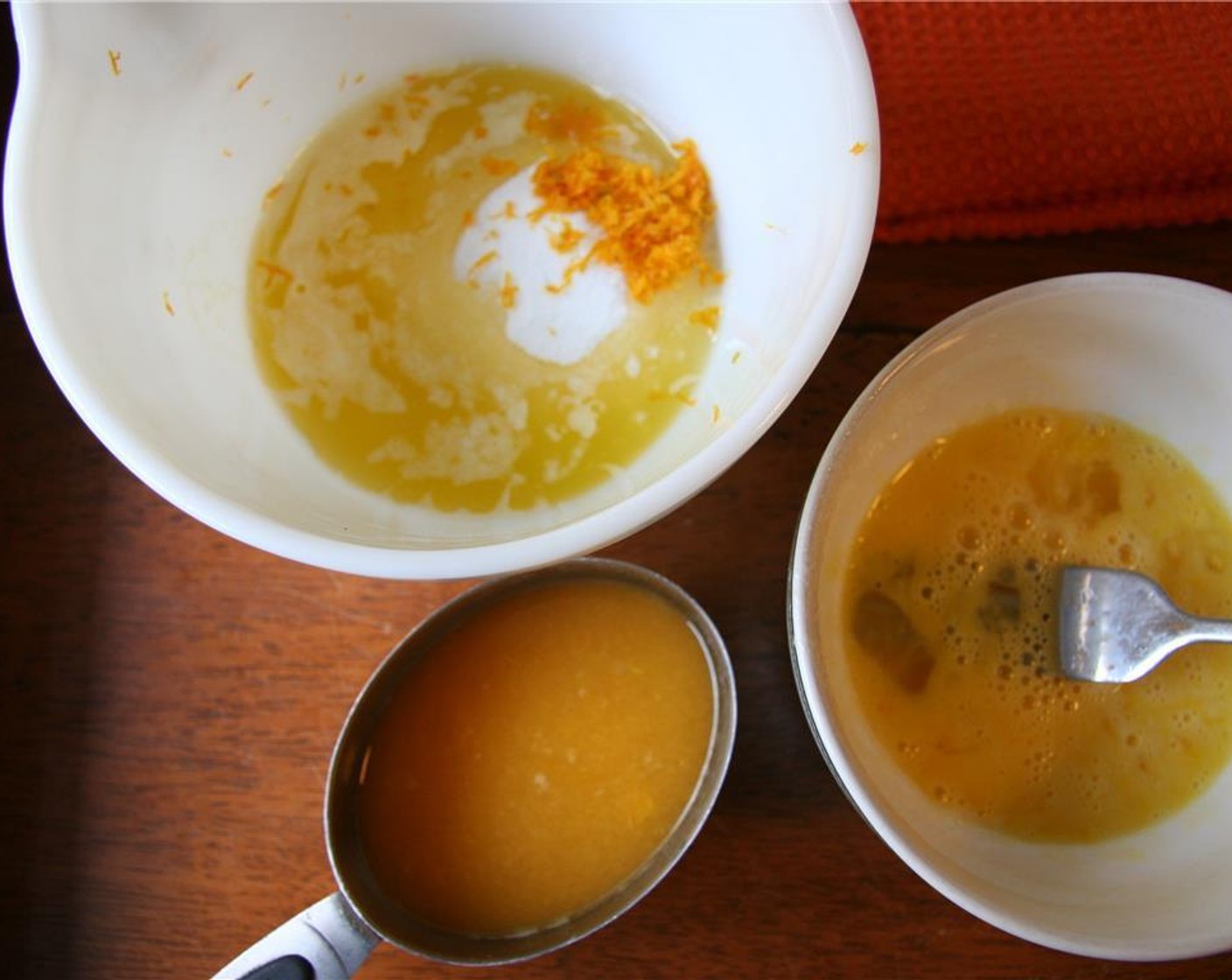 step 3 Melt two-thirds of the Unsalted Butter (4 Tbsp) and combine with the Granulated Sugar (1/2 cup), 5 tsp of zest and 1/2 cup of juice from the Oranges (2), Eggs (2), and Vanilla Extract (1 tsp).