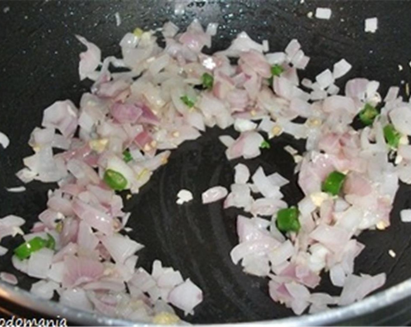 step 2 Heat Vegetable Oil (1 tsp) in a skillet and sauté Garlic (2 cloves), Onion (2/3) and Chili Pepper (1) over medium-high heat until they are very slightly browned.