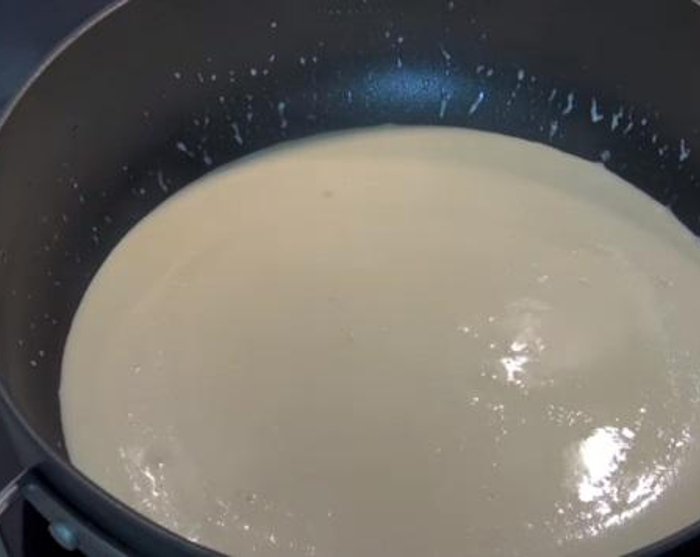 step 2 In a saute pan over medium heat, cook together the Butter (1 oz) and Garlic (4 cloves). Then add in the Whipping Cream (1/2 cup) and allow it to simmer for 5 minutes.