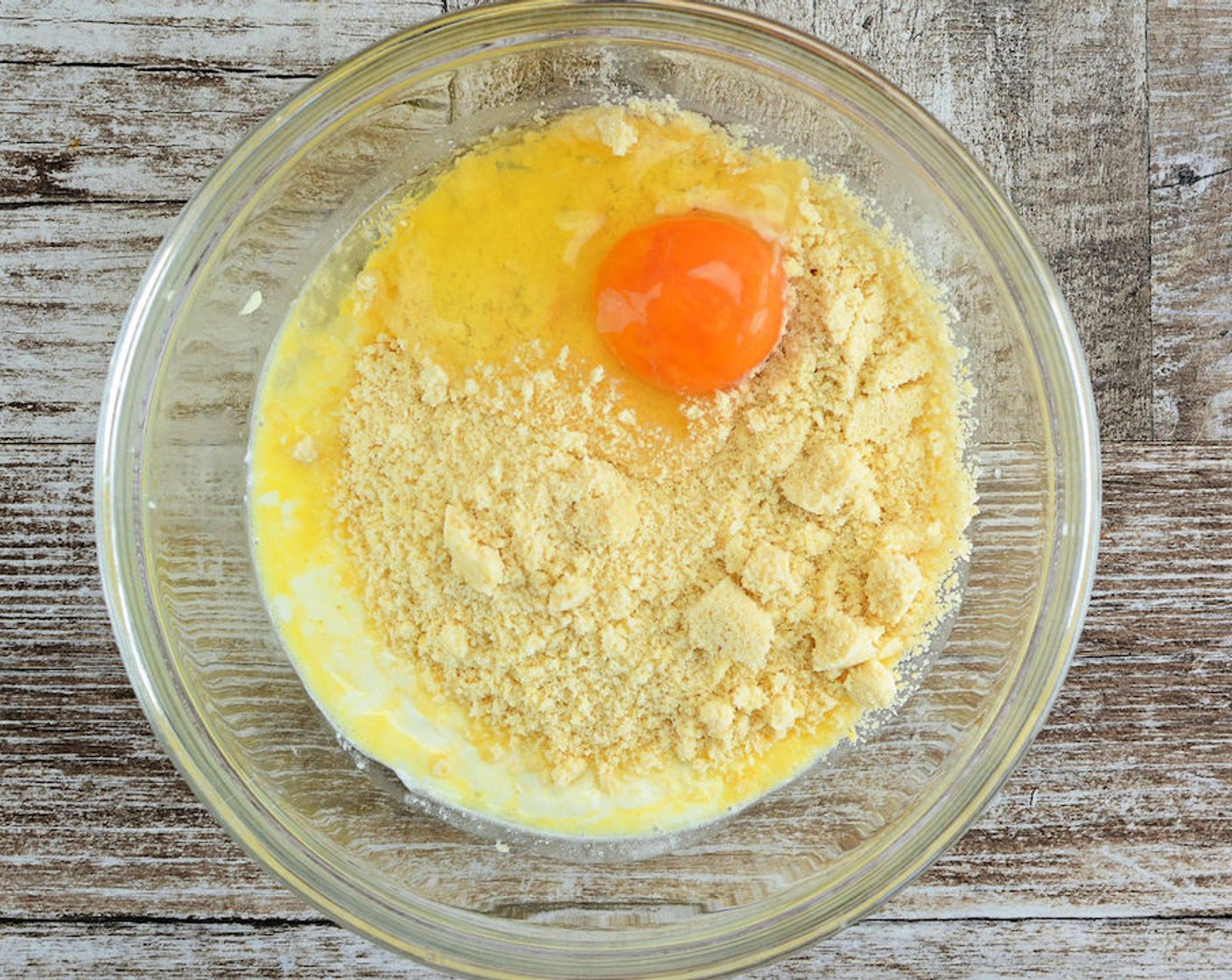 step 4 Add Almond Flour (1 cup) into the cheese mixture and stir it. Then add the Large Egg (1) and mix thoroughly until a dough-like consistency.